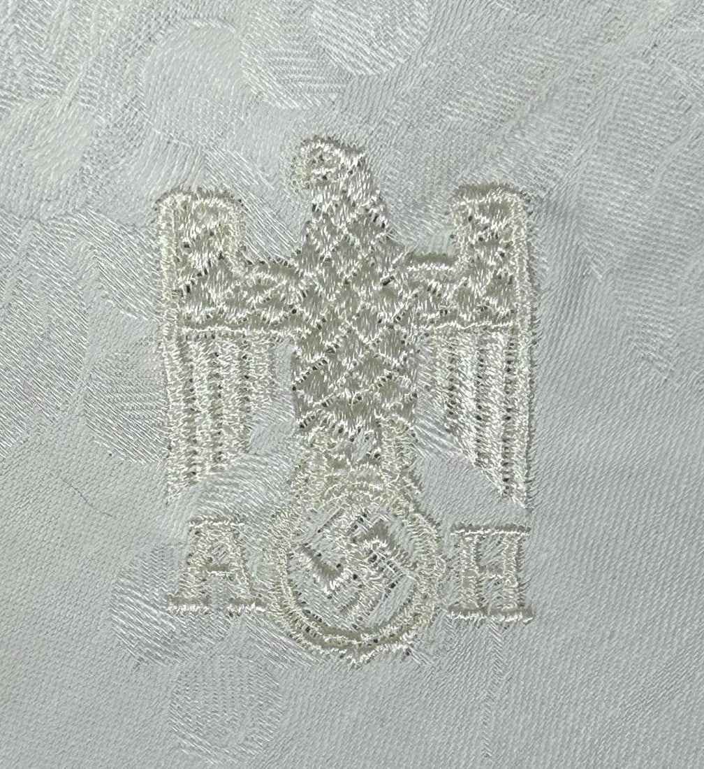 WWII Nazi German Adolf Hitler Linen Formal Pattern Napkin: World War II Nazi German Adolf Hitler Linen Formal Pattern Napkin. Measures 19.5" x 18.875". The front bottom corner features an embroidered German Adler eagle clutching a swastika in his talon above