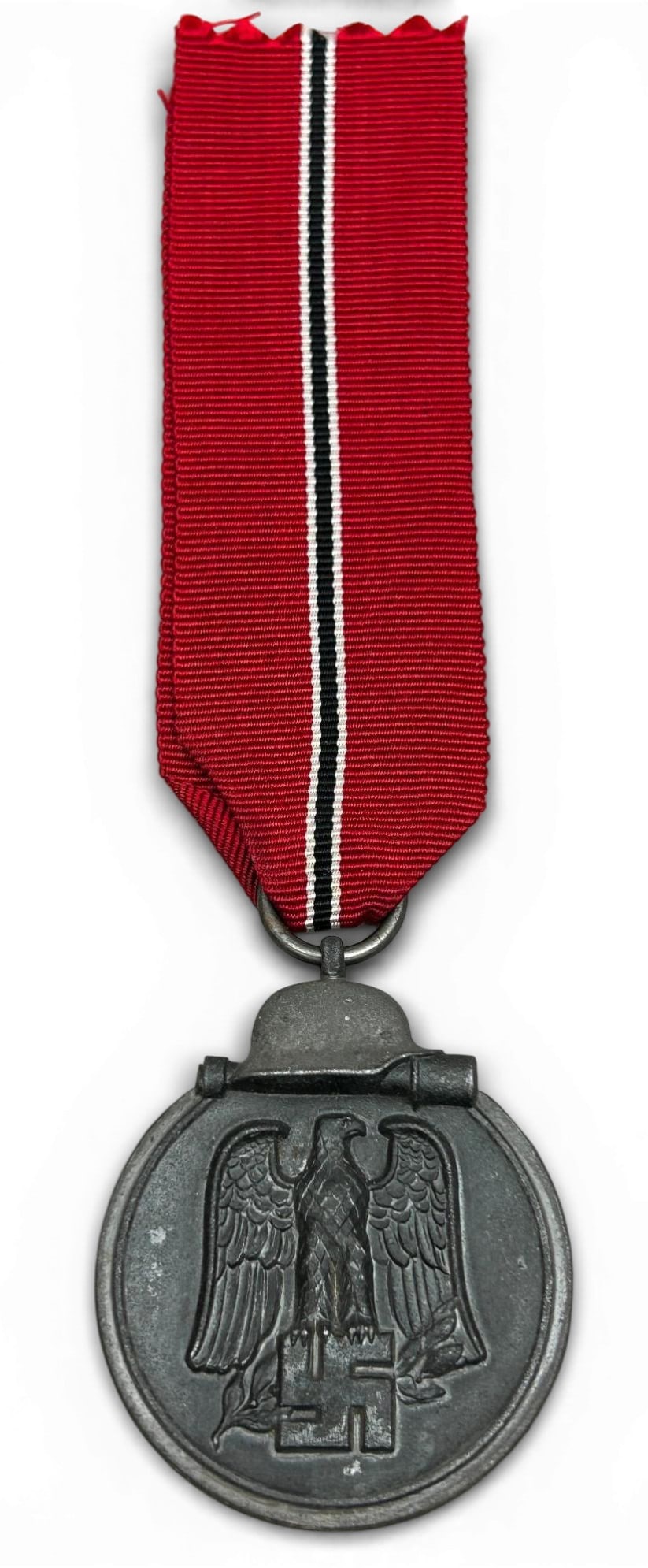 WWII Nazi German Eastern Front Medal: German World War II Eastern Front 1941/42 medal. Nedal without ribbon measures 1.625" x 1.5". The obverse shows a German eagle clutching a swastika in his talons. There is a German helmet with a potat