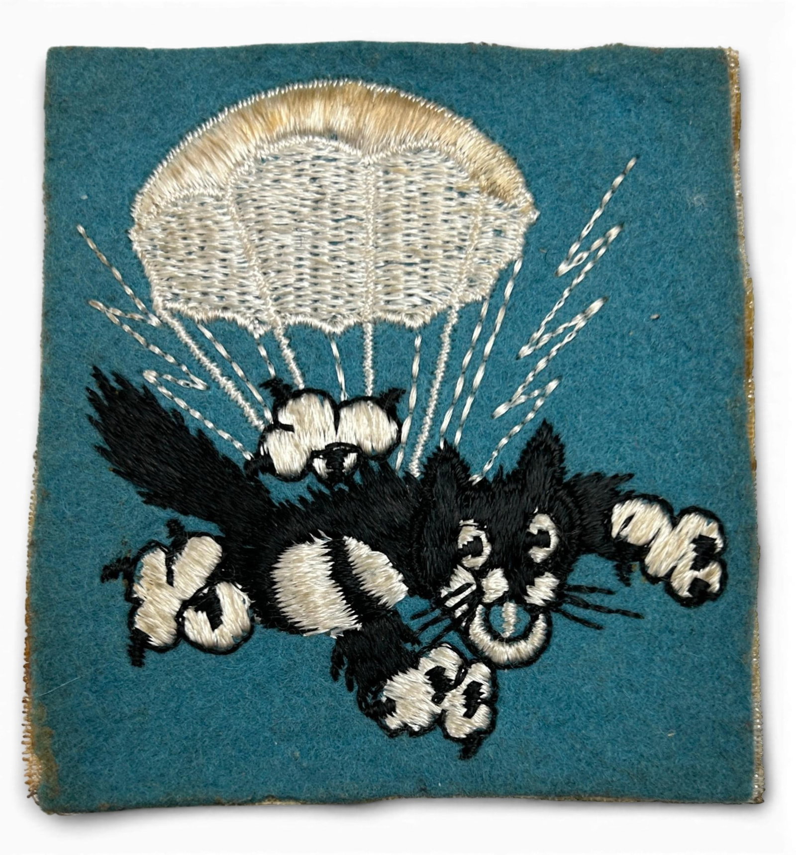 WWII 503rd Parachute Infantry Regiment Patch: World War Two 503rd Airborne Parachute Infantry Regiment PIR square "wildcat" patch. consisting of embroidery on felt and backed with cheesecloth. This patch was removed from a scrapbook. Measures 3 1