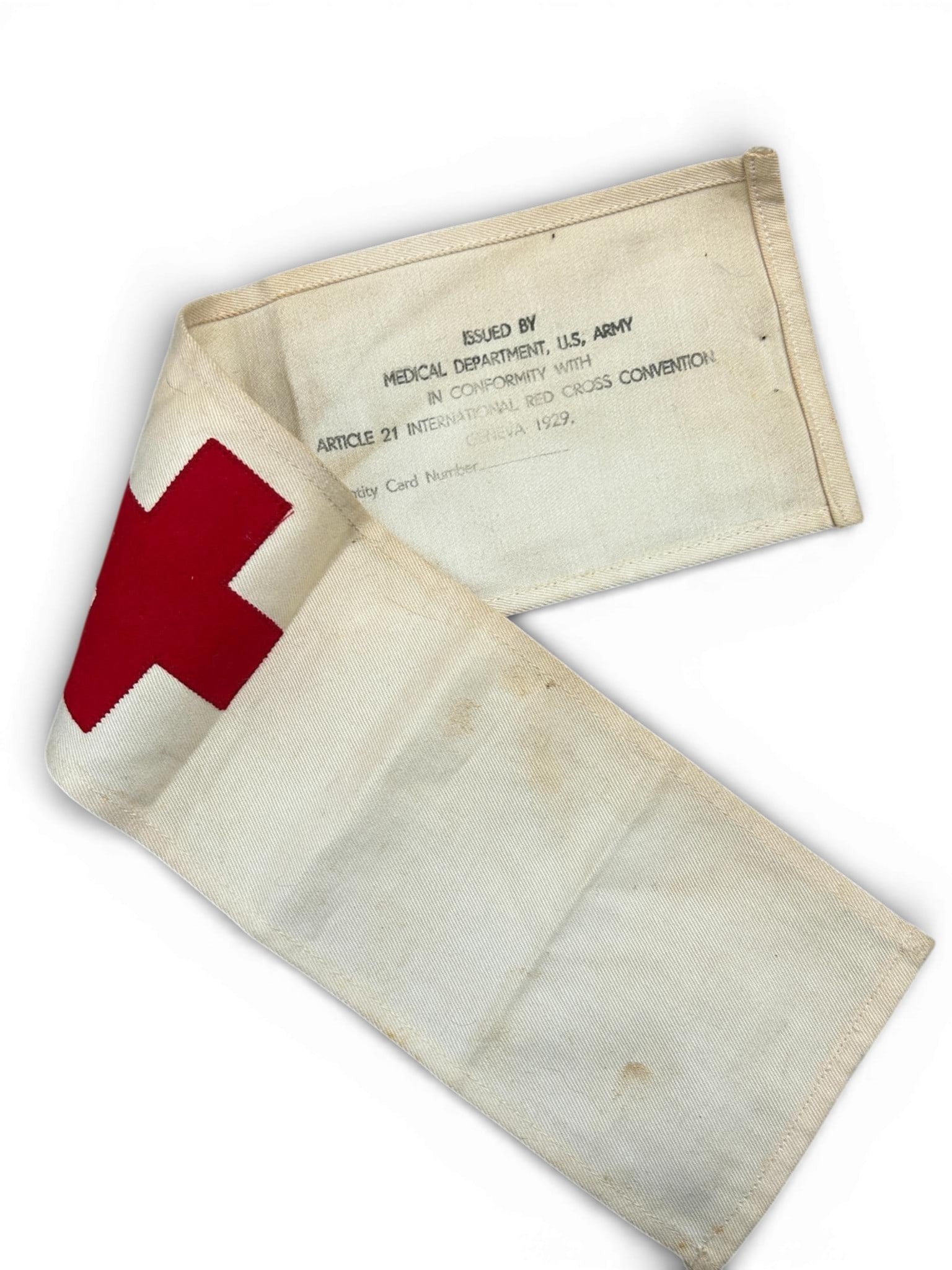 WWII U.S. Army Medic Armband With Geneva Convention Markings - Unissued: Unissued World War Two United States Army cotton military medic armband. The red cross is stitched to the obverse with the correct zig-zag stitch pattern while the reverse bears the U.S. Medical