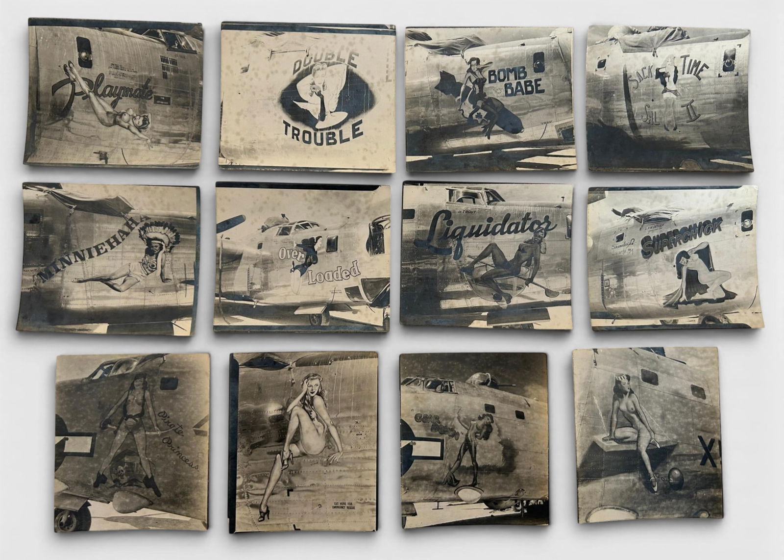 WWII U.S. Army Air Force AAF B-24 Nose Art Photograph: World War Two U.S. Army Air Force nose art photo lot including 12 photographs of nose art painted on B-24 bombers. Each photo measures 3.125" x 3.75". These are original WWII nose art photographs,