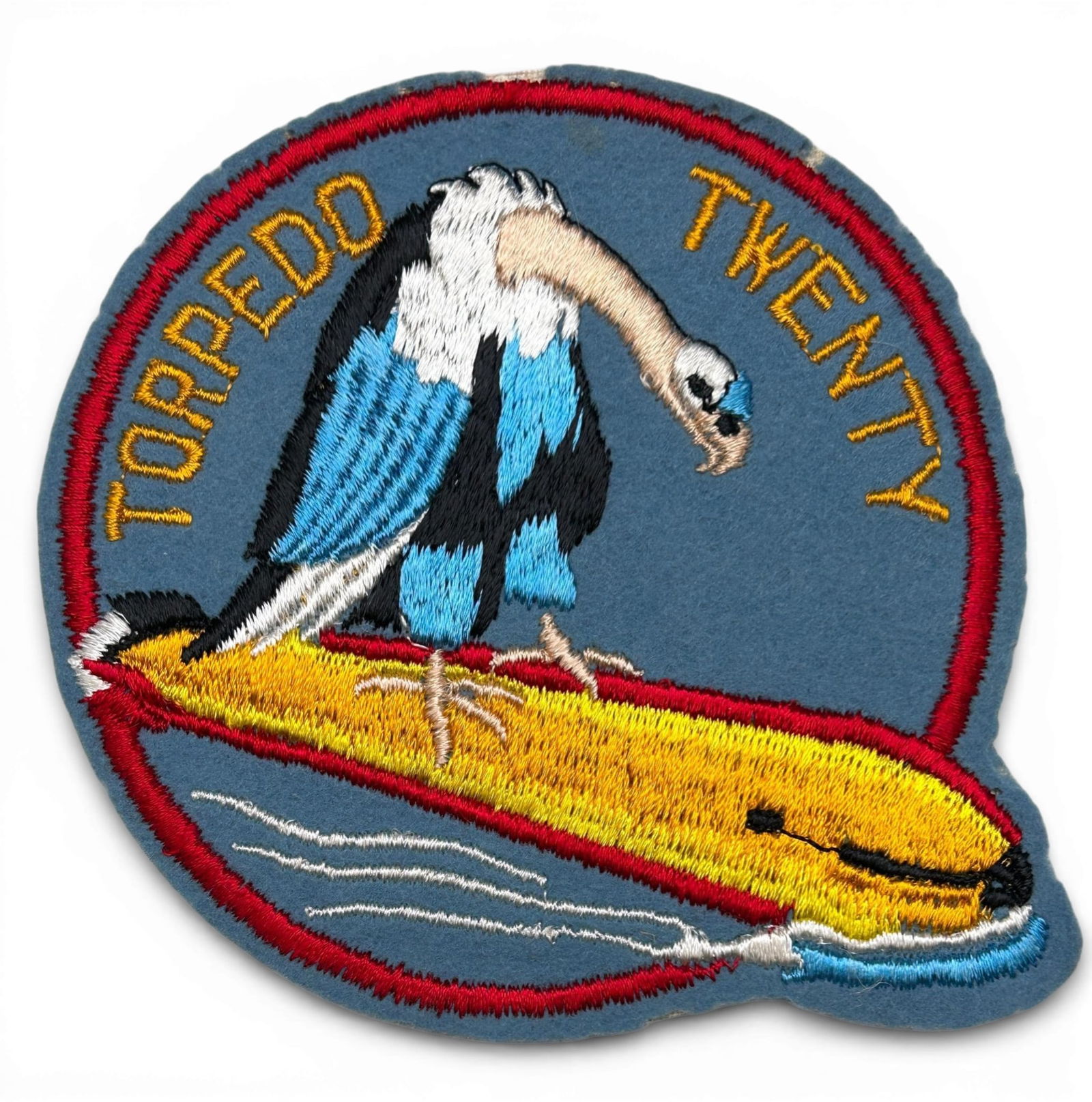 WWII U.S. Navy VT-20 Torpedo Squadron Patch: World War Two U.S. Navy Torpedo Squadron Twenty (VT-20) squadron patch. The patch is schiffli embroidery on wool. The insignia approved by the Office of Chief of Naval Operations - CNO on March