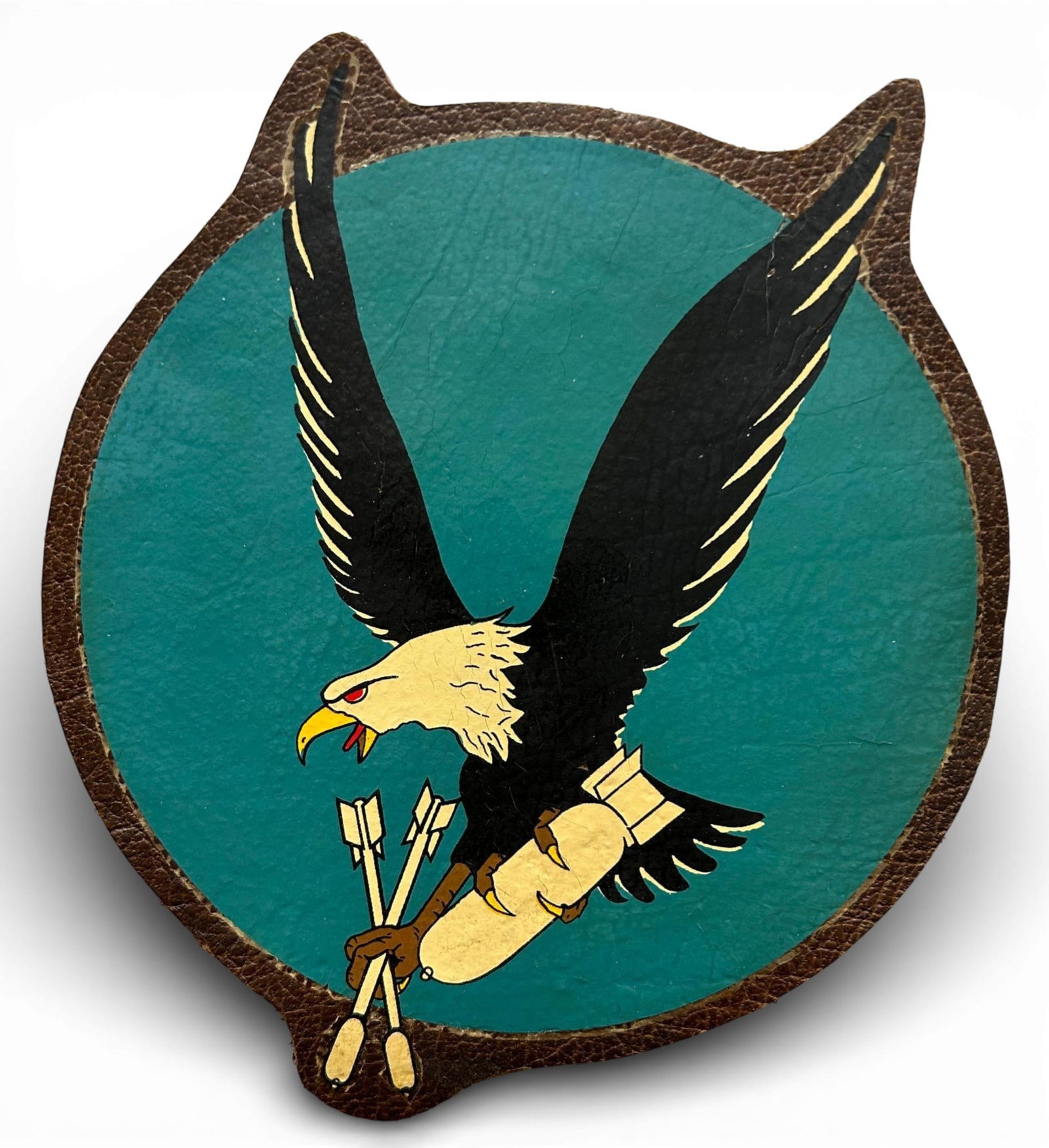 WWII U.S. Navy VB-10 Bombing Squadron Patch: World War Two U.S. Navy VB-10 squadron patch. The patch is painted on leather. Measures 7.875" x 6.5". Established as Bombing Squadron Ten (VB-10) on June 3,1942. Deployed on the USS Enterprise (flew