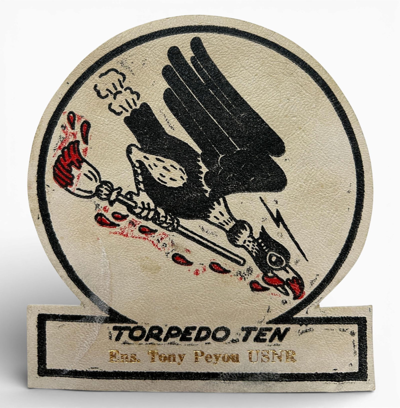 WWII U.S. Navy Identified VT-10 Torpedo Squadron Patch: World War Two U.S. Navy identified VT-10 squadron patch. The patch is paint on leather. Measures 4.5" x 4". Identified to "Ens. Tony Peyou USNR" in gold lettering. Established as Torpedo Squadron