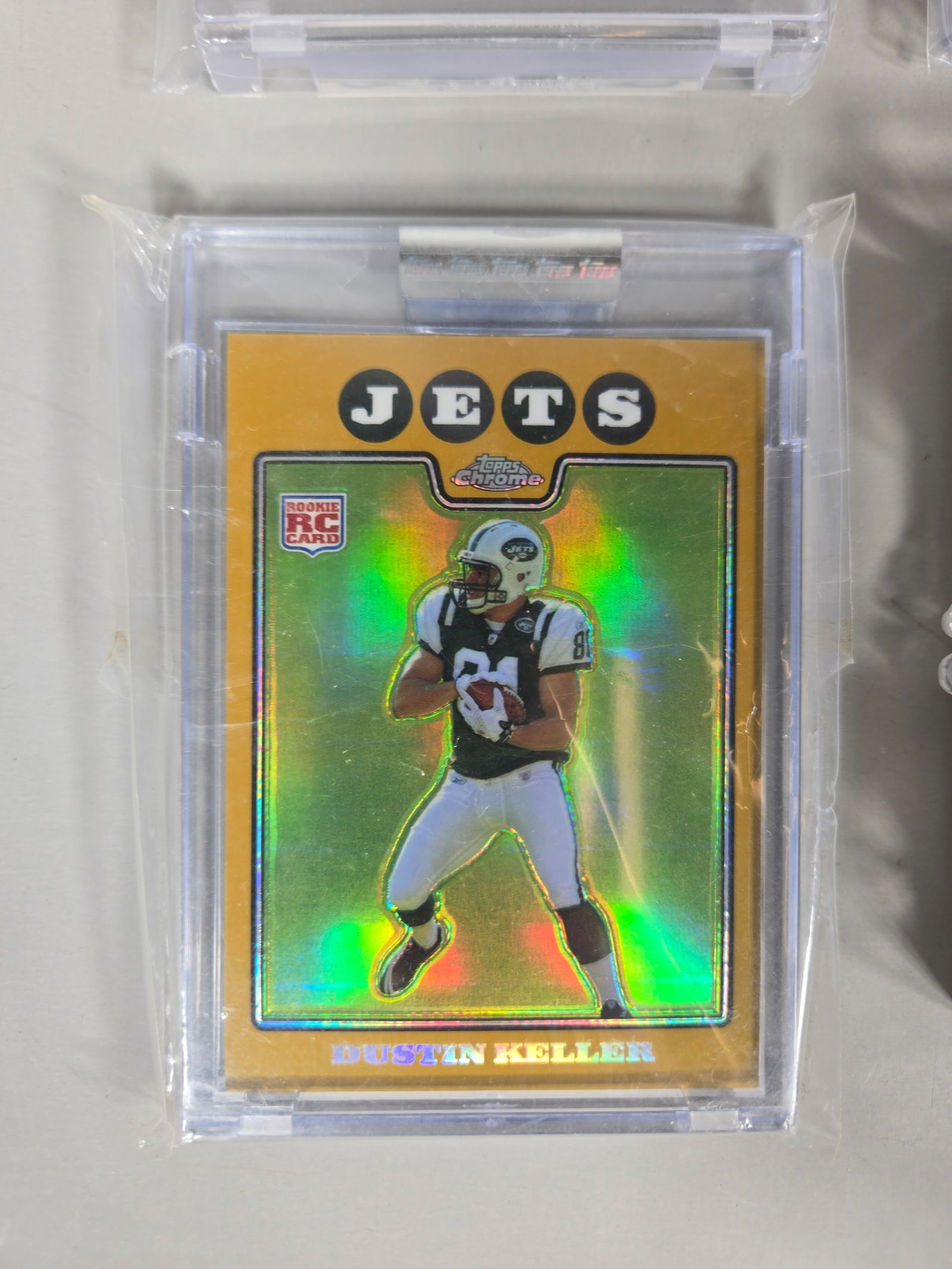 A Collection of American Football Trading Cards Including 1957 Topps Tom McDonald Rookie Card: A group of vintage and modern American football trading cards featuring various players, teams, and manufacturers. The collection is led by a 1957 Topps #124 Tom McDonald rookie card. Other vintage ex