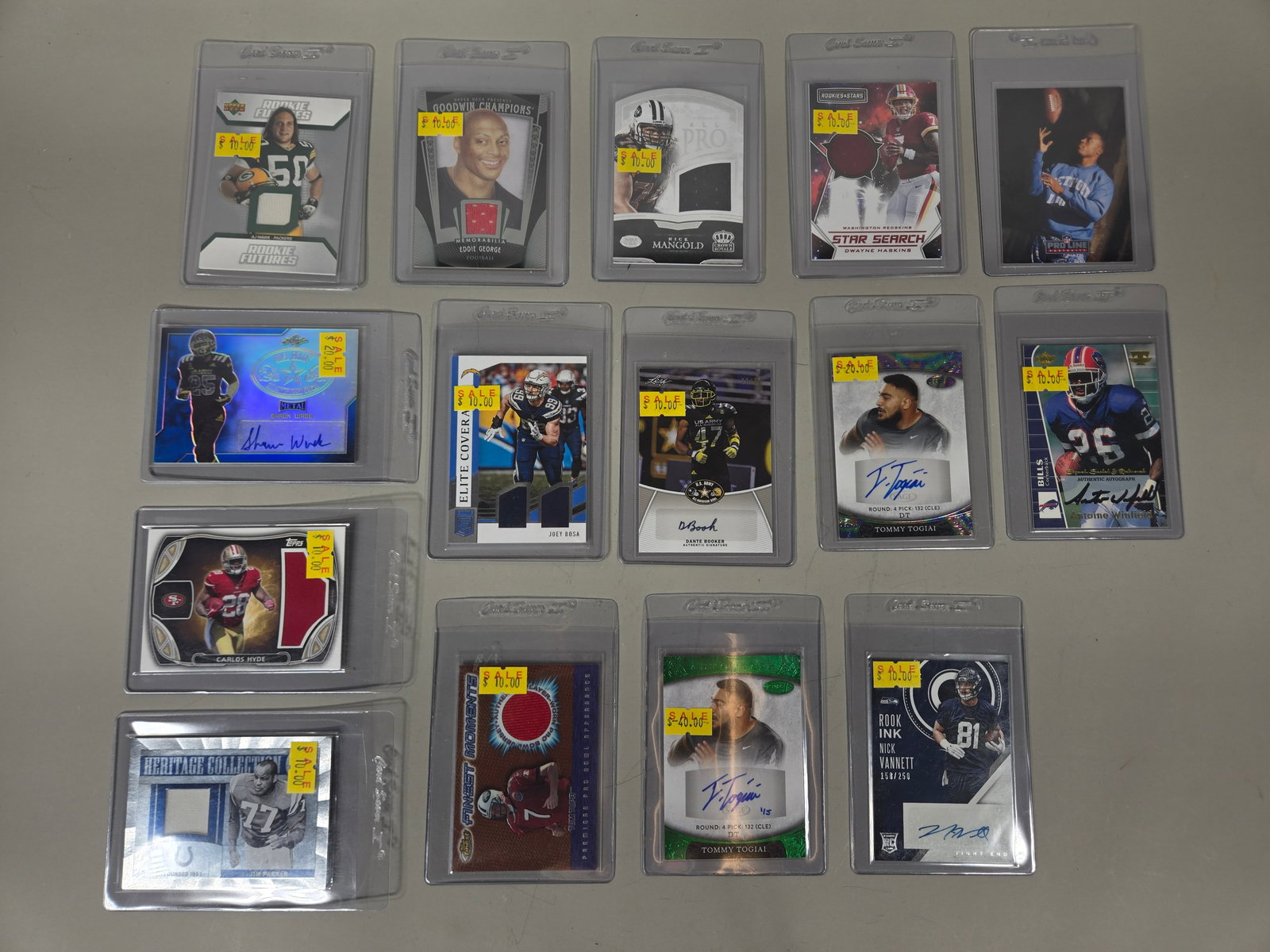 A Collection of Modern NFL Trading Cards Featuring Autographs and Memorabilia: A collection of modern-era American football trading cards from various manufacturers including Topps, Panini, Upper Deck, Leaf, and Sage. The group features a mix of rookie issues, player-worn memora