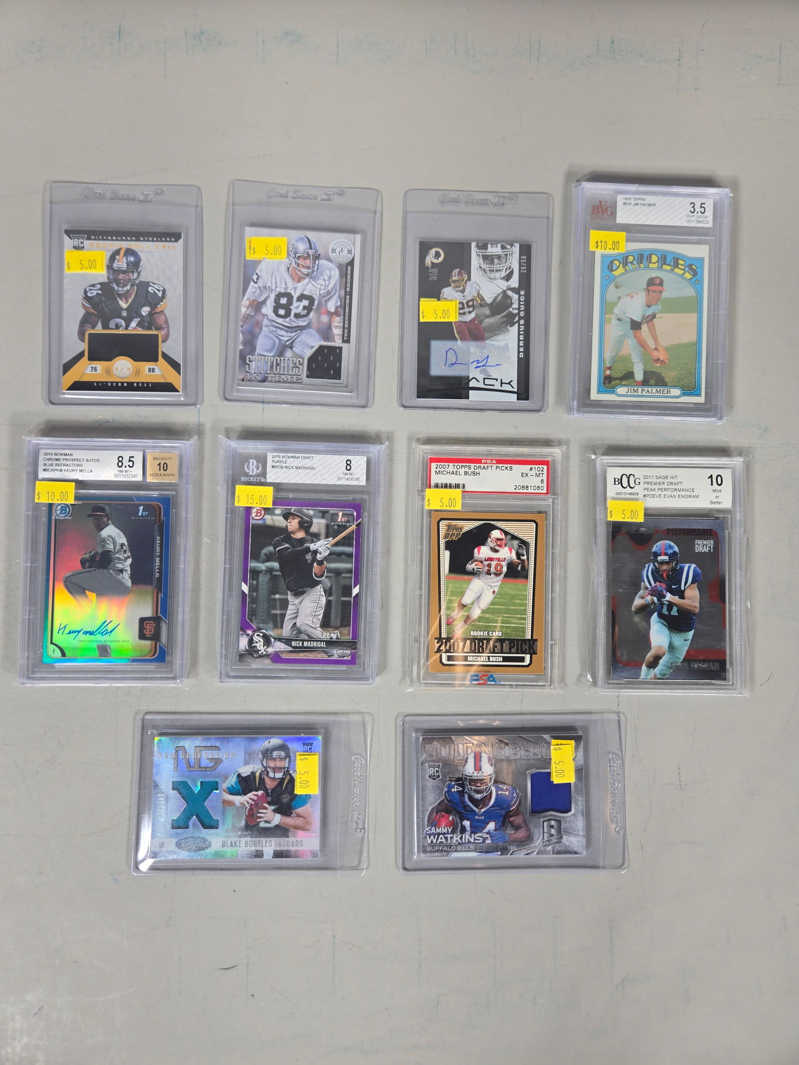 A Collection of Professional MLB and NFL Trading Cards Including Graded and Relic Issues: A collection of professional sports trading cards featuring athletes from Major League Baseball and the National Football League. The group includes vintage and modern issues with various card types s