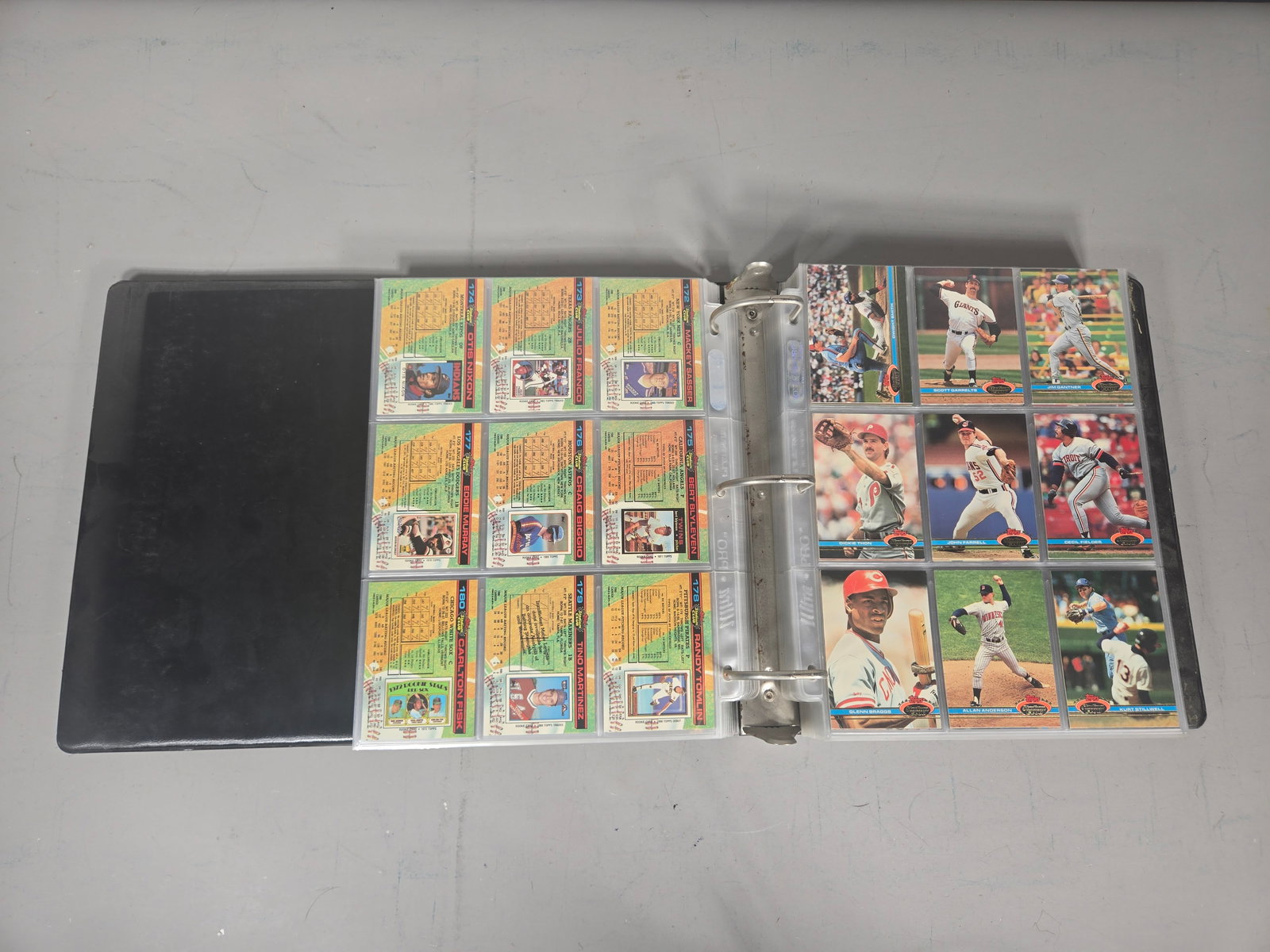 A Complete Set of 1991 Topps Stadium Club Baseball Trading Cards: A complete set of 1991 Topps Stadium Club baseball trading cards presented in a black three-ring vinyl binder. The cards feature borderless full-color photography on the obverse and detailed player st