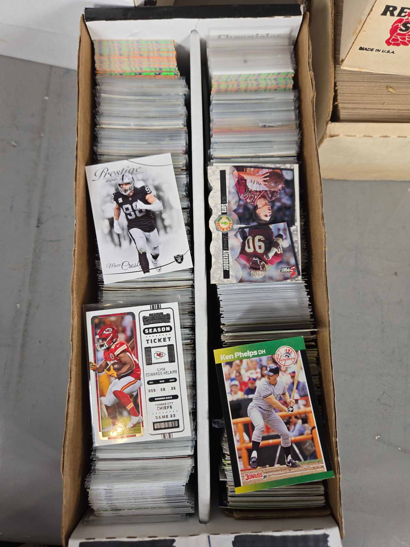 A Collection of Sports Trading Cards Housed in Vintage Red Wing Shoes and Fleer Boxes: This lot features a large collection of sports trading cards, primarily comprising baseball and football examples from the late 1980s to early 1990s, with some contemporary and basketball cards presen