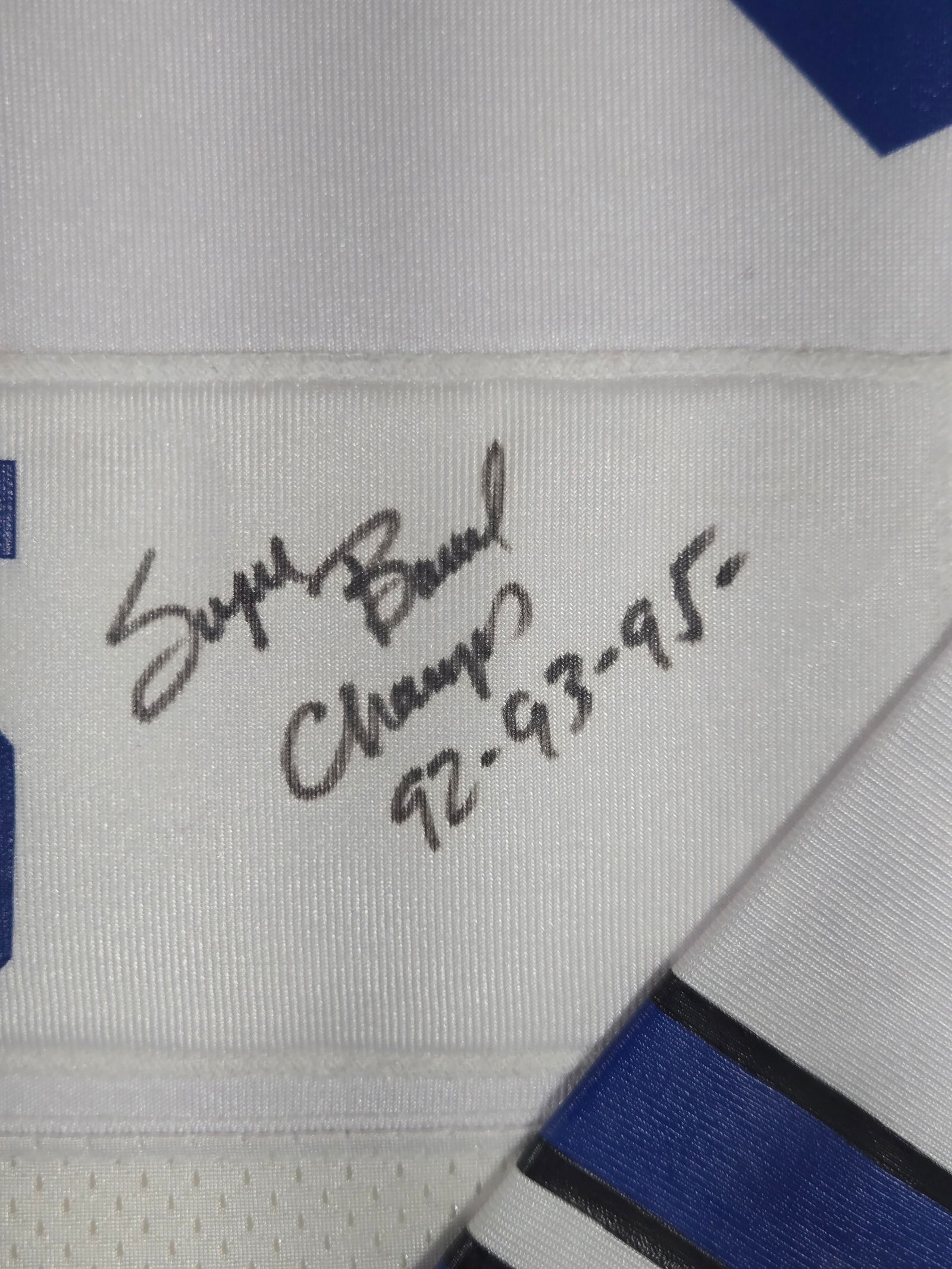 Framed Autographed Bill Bates Dallas Cowboys Jersey: A professionally framed and autographed Dallas Cowboys jersey attributed to safety Bill Bates. The white mesh jersey features the player name BATES and number 40 in blue block lettering. The piece inc