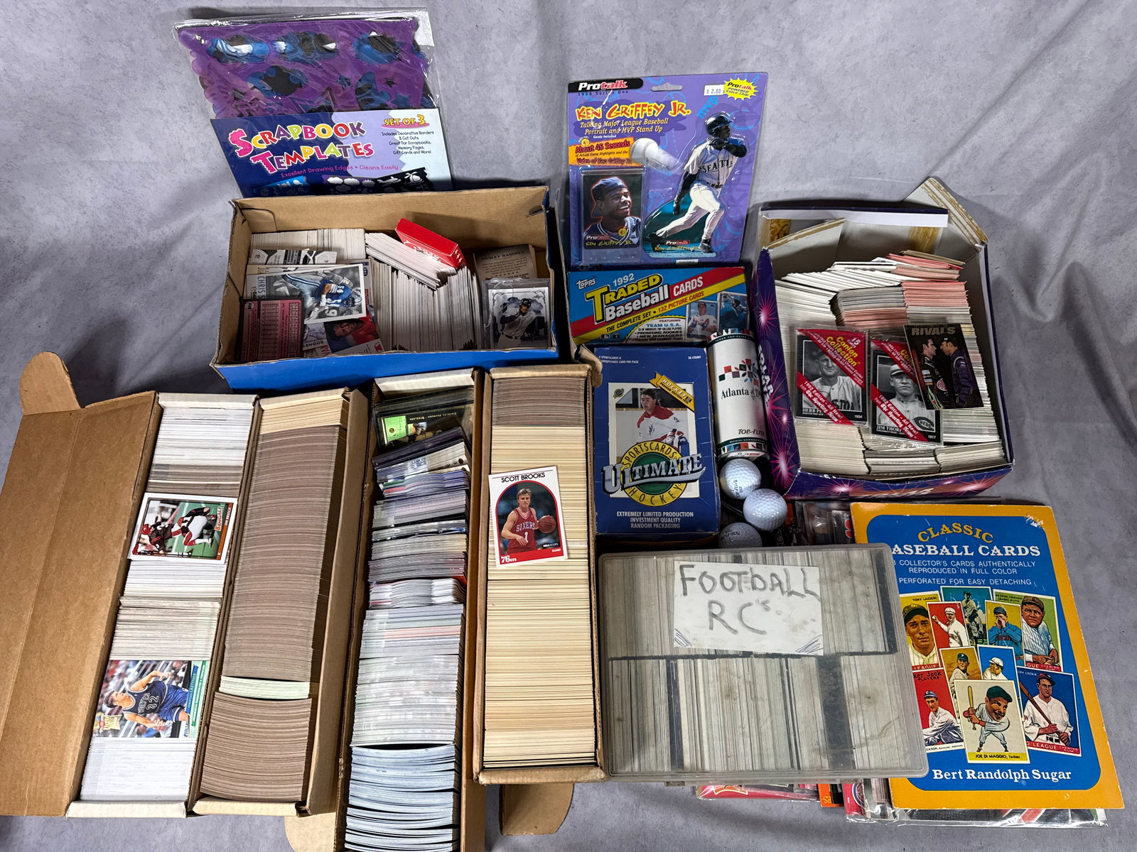 1980s-2013 Multi-Sport Trading Card and Memorabilia Collection featuring 1992 Topps Traded Set and: This comprehensive sports collection features a 1992 Topps Traded Baseball Complete Set of 132 cards including early cards of Phil Nevin and Team USA. Key single cards include a 1992-93 Topps Stadium