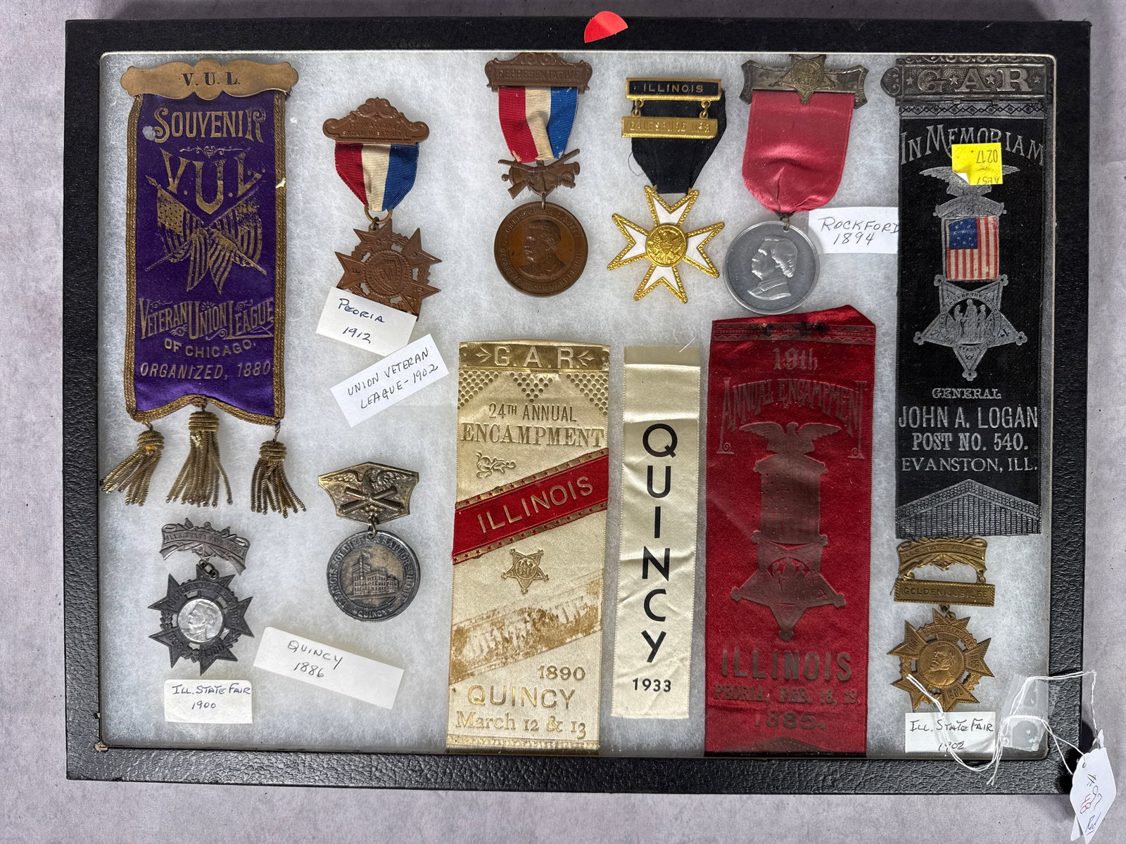 A Collection of Grand Army of the Republic and Illinois Veteran Reunion Medals and Ribbons: This collection consists of multiple late 19th and early 20th-century American commemorative medals and ribbons, primarily associated with the Grand Army of the Republic (G.A.R.) and the Veteran Union
