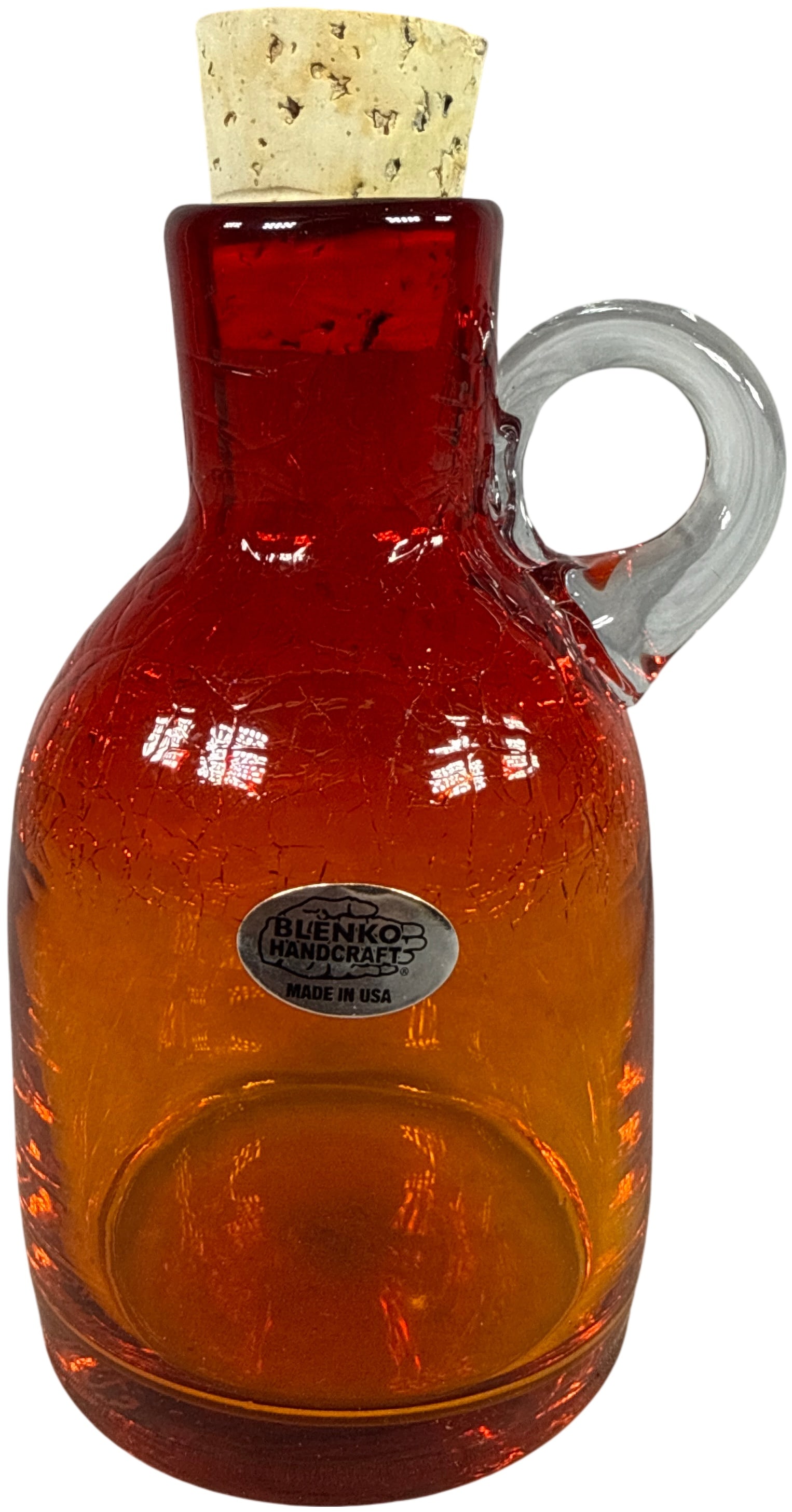 Blenko Glass Tangerine Crackle Glass Moonshine Jug No. 3115S: A Blenko Glass Moonshine Jug, model 3115S, in the tangerine colorway. The vessel features a gradient color transition from deep red at the neck to an orange-amber base with a distinctive crackle