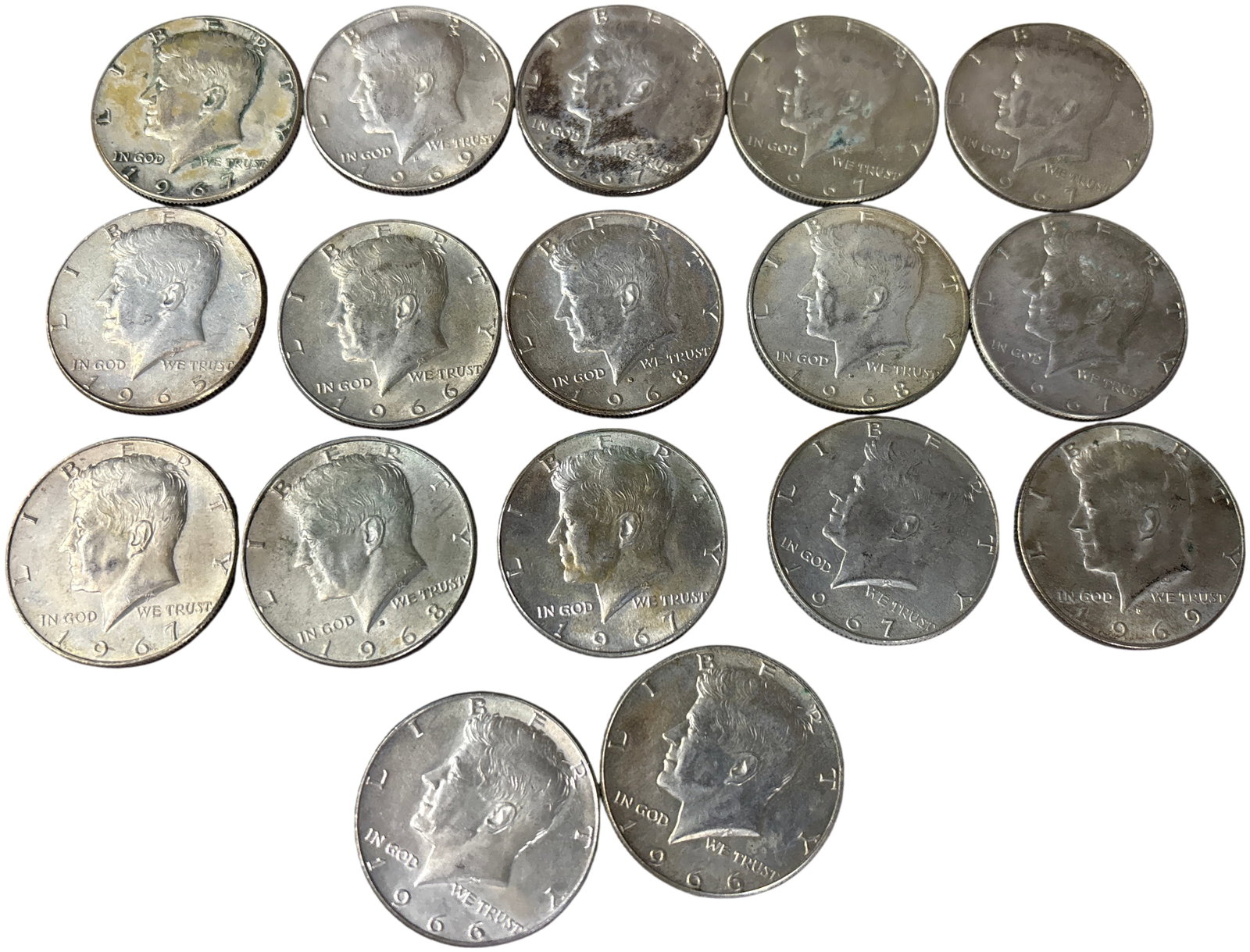 17 US Kennedy Half Dollars 40 Percent Silver 1965-1969: This lot consists of 17 US Kennedy half dollars issued between 1965 and 1969. These coins feature a silver-clad composition containing 40 percent silver (KM# 202a). The collection includes dates from 