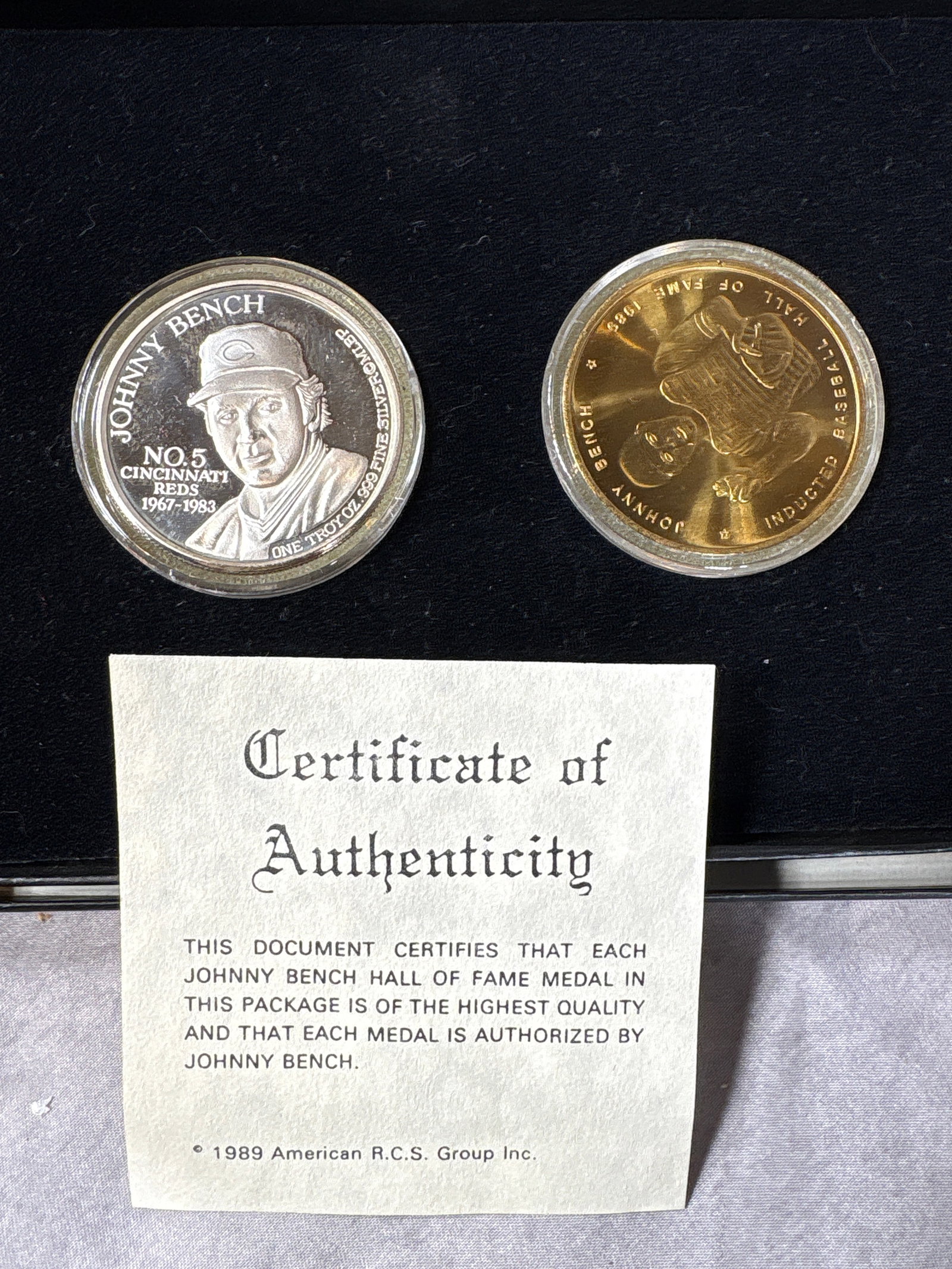 A Pair of 1989 Johnny Bench Hall of Fame Commemorative Medals with Certificate of Authenticity 999: This set consists of two commemorative medals issued to honor Johnny Bench's 1989 induction into the Baseball Hall of Fame. One medal is struck in one troy ounce of .999 fine silver and features a por