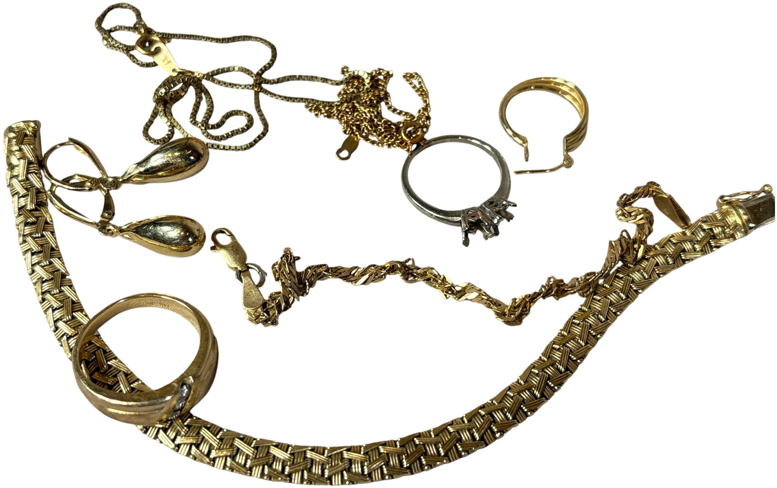 An Assortment of 14 Karat Yellow and White Gold Jewelry, 31.60 Grams: An assortment of 14 karat yellow and white gold jewelry. This collection features a wide, woven-texture yellow-tone bracelet equipped with a box clasp and safety catch. Included is a yellow-tone ring 