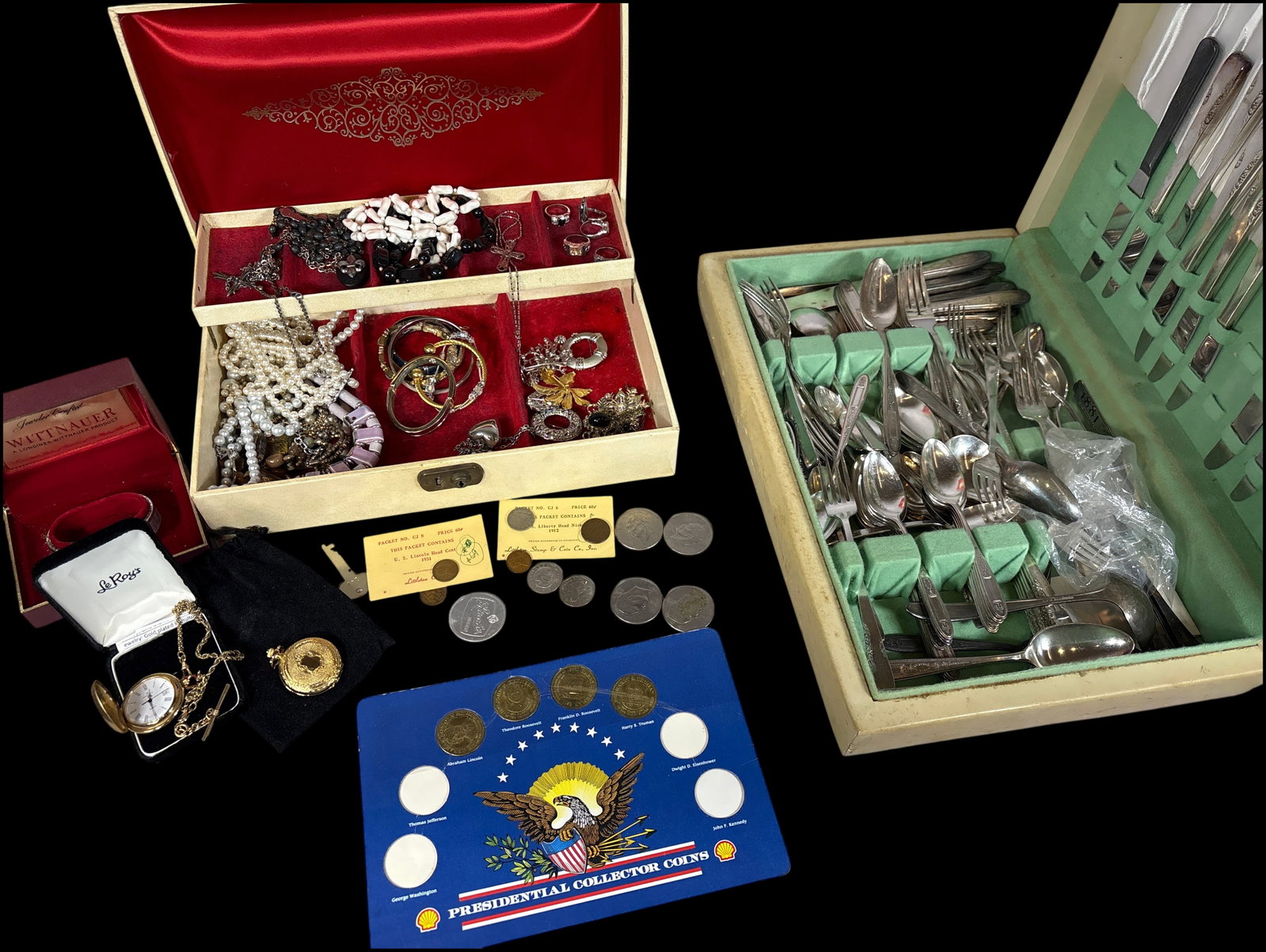 A Collection of Costume Jewelry, Vintage Watches, US Coins, and 1881 Rogers Silver-Plated Flatware: This group contains a diverse range of collectible items and household goods. The largest component is a set of silver-plated flatware by 1881 Rogers, presented in a green-felt-lined wooden chest, fea