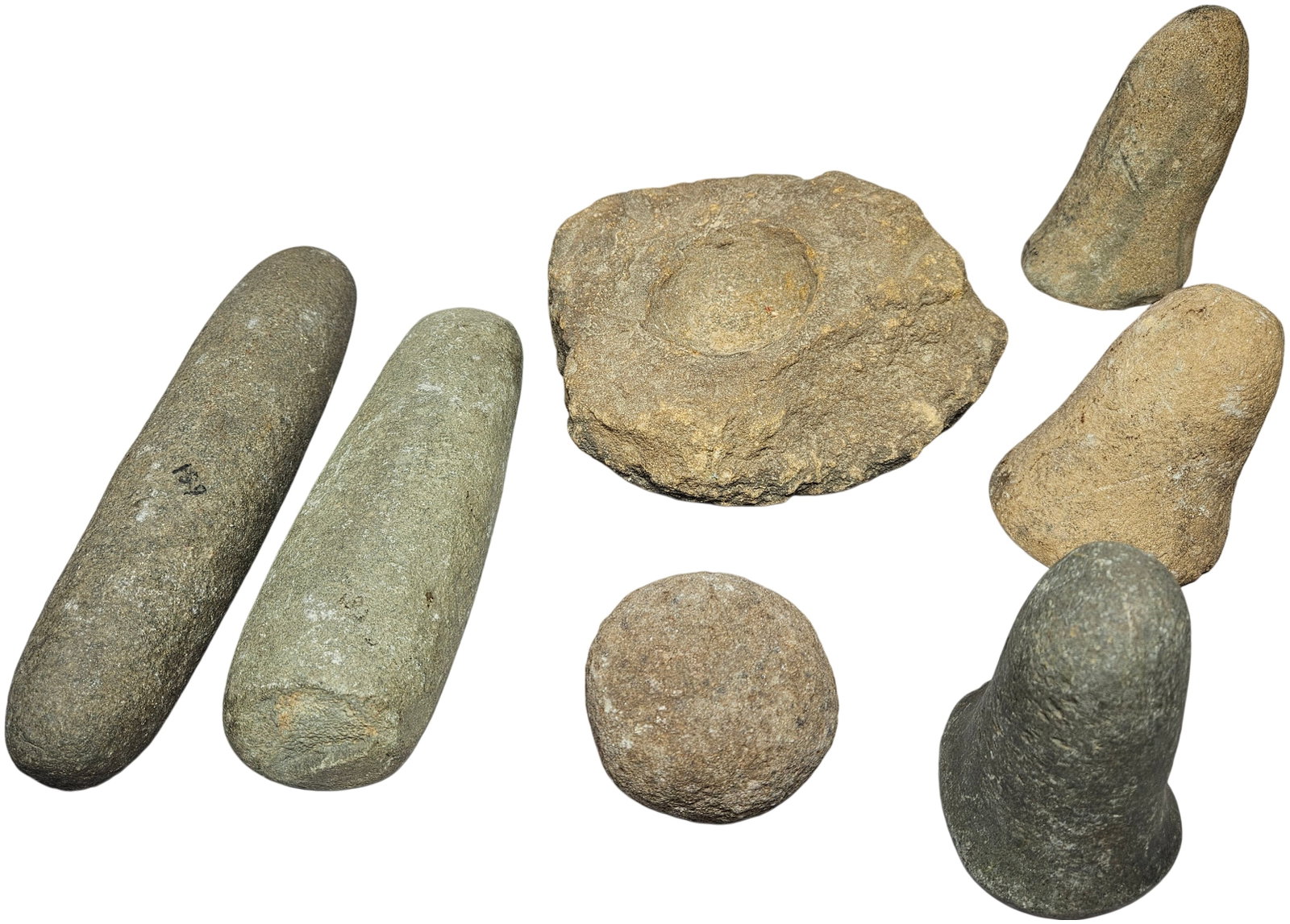 A Group of Native American Lithic Artifacts including Pestles and a Nutting Stone (1 of 14)