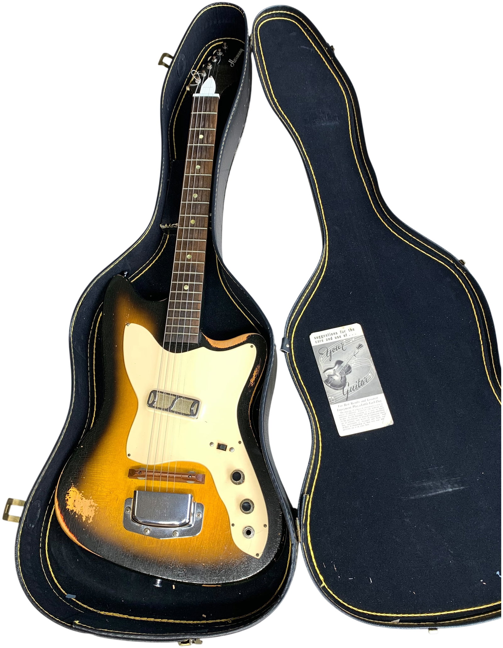 Harmony Bobkat H14 Electric Guitar in Sunburst Finish: Harmony Bobkat H14 electric guitar, manufactured by the Harmony Company in Chicago, Illinois, circa 1960s. This offset solid-body instrument features a sunburst lacquer finish and a bolt-on maple