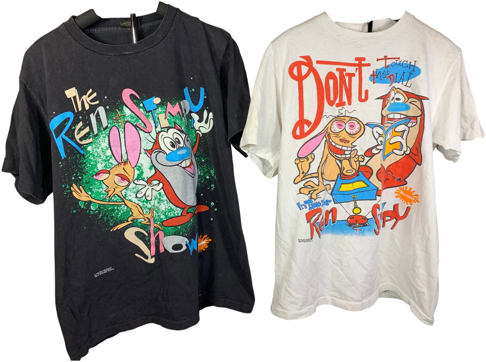 Vintage 1990s The Ren and Stimpy Show Graphic T-Shirts by Changes: This lot features vintage graphic t-shirts depicting characters from the Nickelodeon animated series The Ren and Stimpy Show. Both garments were manufactured by Changes in Queens, New York, and are
