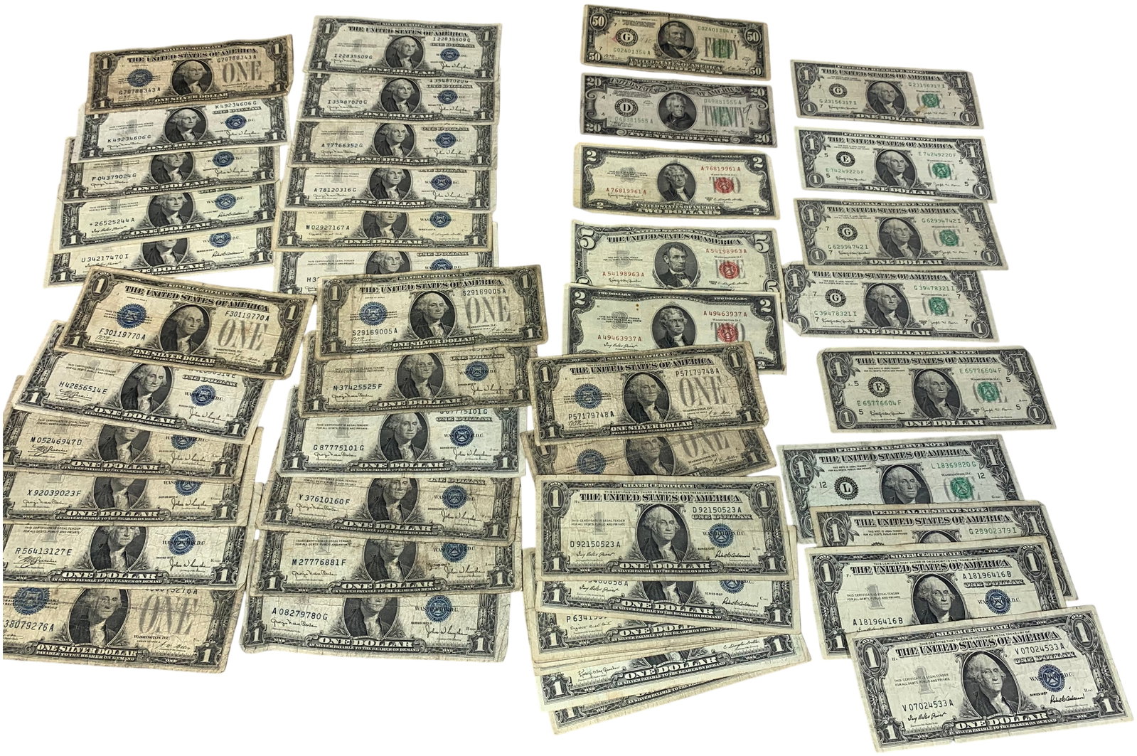 A Collection of US Small-Size Banknotes Including Silver Certificates, US Notes, and Federal Reserve: This collection consists of multiple circulated United States small-size banknotes in denominations of $1, $2, $5, $20, and $50. The assembly features numerous $1 Silver Certificates with blue treasur