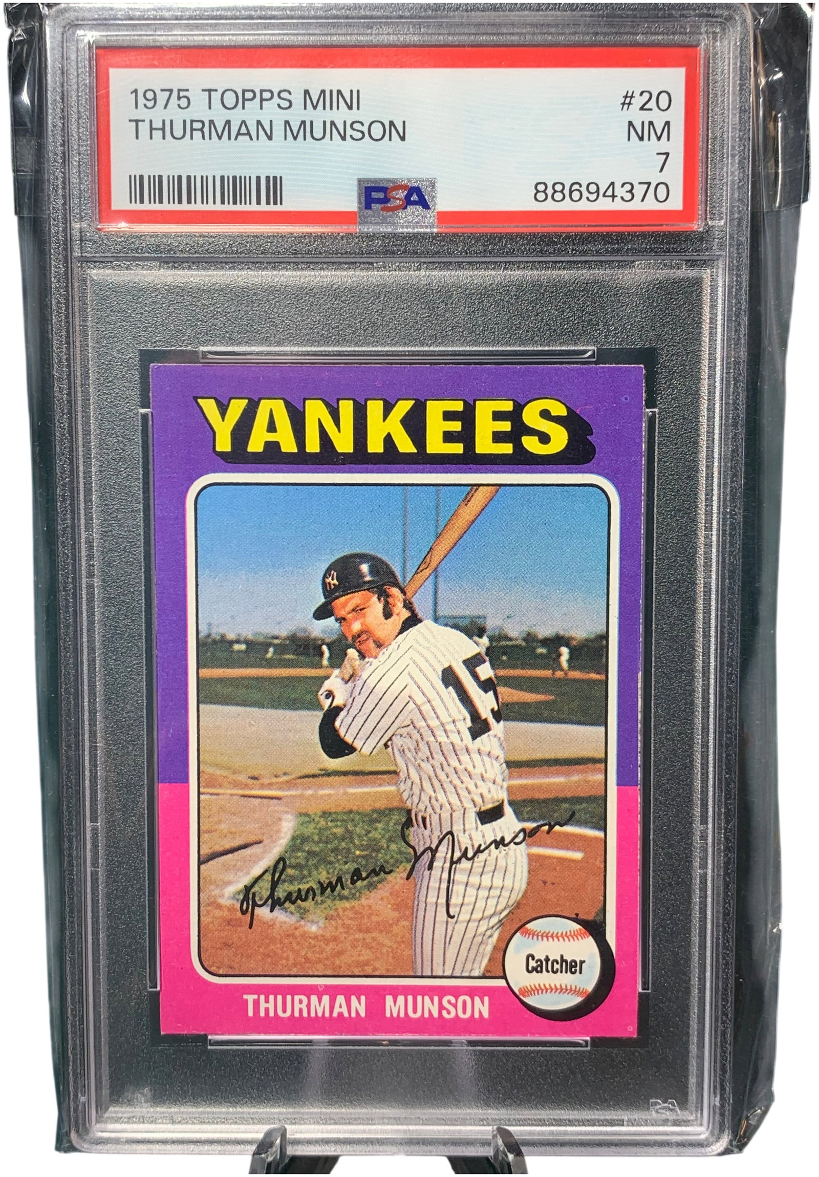 1975 Topps Mini Thurman Munson #20 PSA 7 NM: This is a professionally graded 1975 Topps Mini baseball card featuring Thurman Munson of the New York Yankees. The card is numbered 20 in the set. This specific card is the Mini variant, which was pr