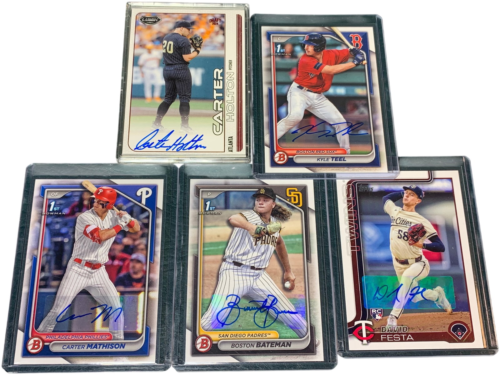A Collection of Autographed Bowman and Topps Baseball Cards: A collection of autographed baseball cards featuring Carter Holton (numbered 30/65), Kyle Teel, Carter Mathison, Boston Bateman, and David Festa from various Bowman and Topps series. Burns in-house sh