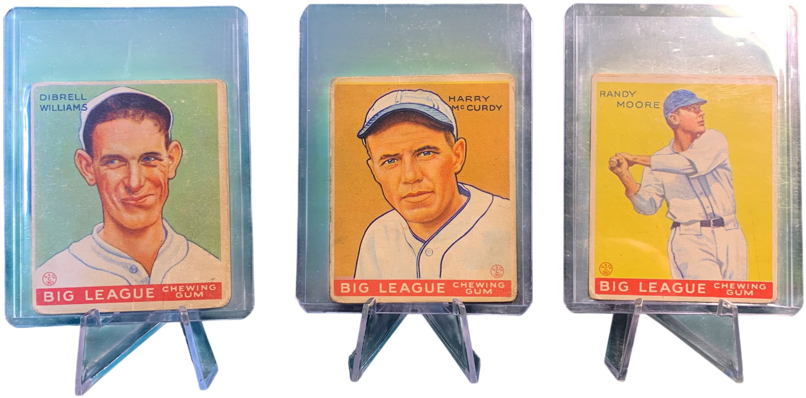 A Trio of 1933 Goudey Big League Chewing Gum Baseball Cards: This lot contains original 1933 Goudey (R319) Big League Chewing Gum baseball cards. The cards feature color lithographic portraits of Major League players set against vibrant monochromatic background