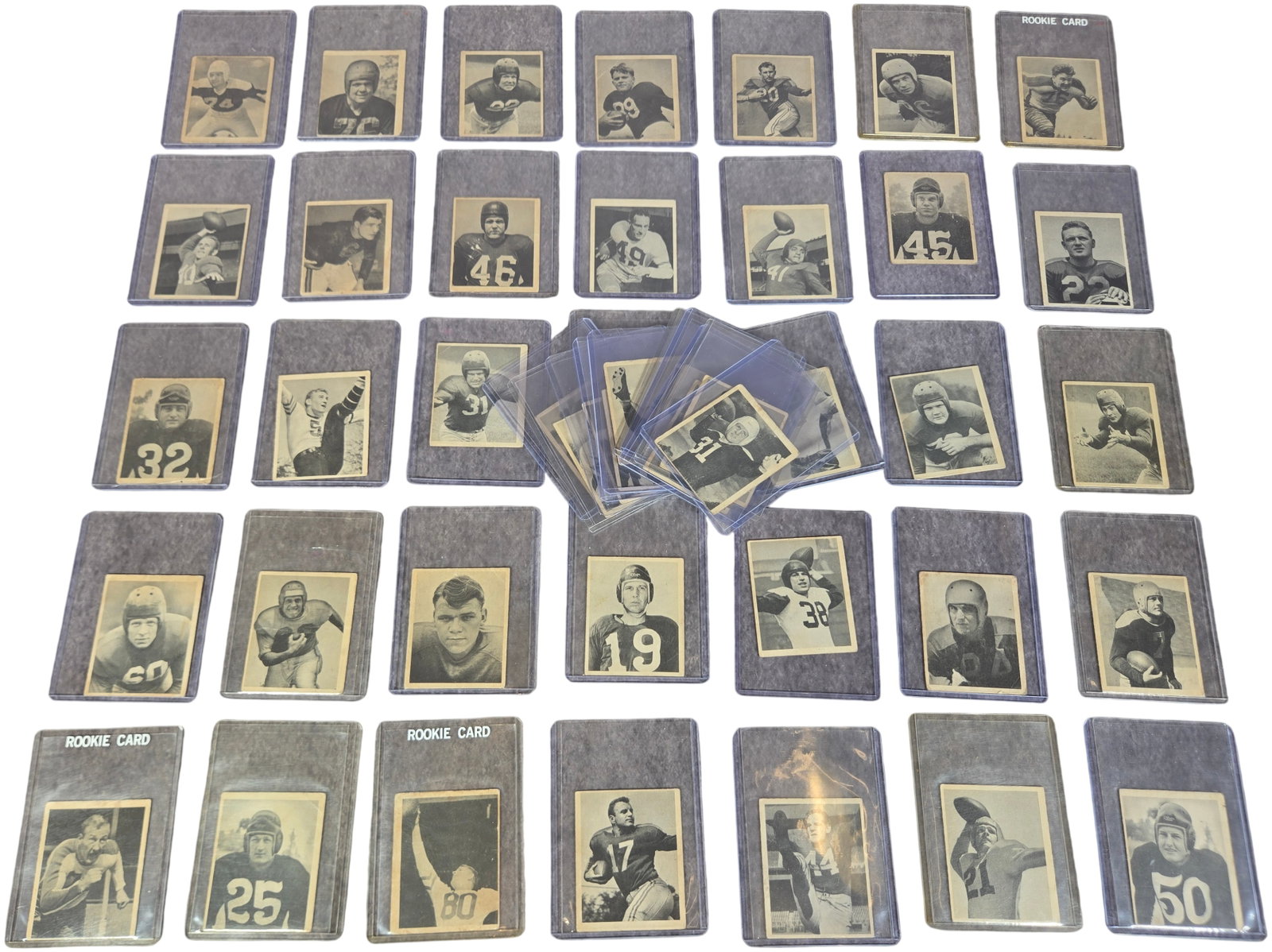 A Collection of 1948 Bowman Football Cards Featuring Major Hall of Fame Rookie Cards: This collection consists of vintage football cards from the 1948 Bowman set, which marked the first major release of football trading cards following World War II. The cards are small-format (approxim