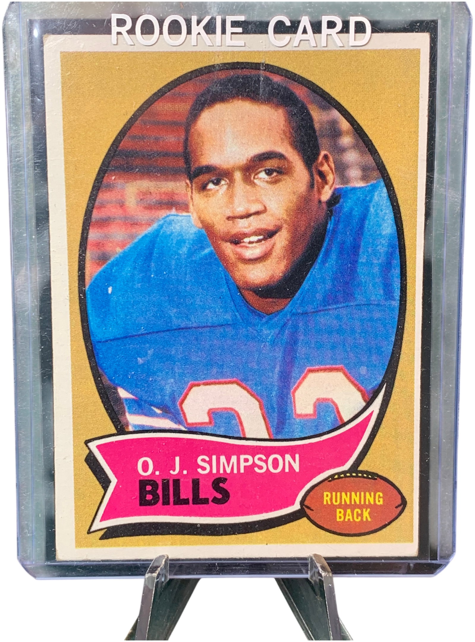 1970 Topps #90 O. J. Simpson Rookie Card Buffalo Bills: This is a 1970 Topps football card, number 90, featuring O. J. Simpson of the Buffalo Bills. This issue is widely identified as the rookie card for Simpson. The front of the card features a color port