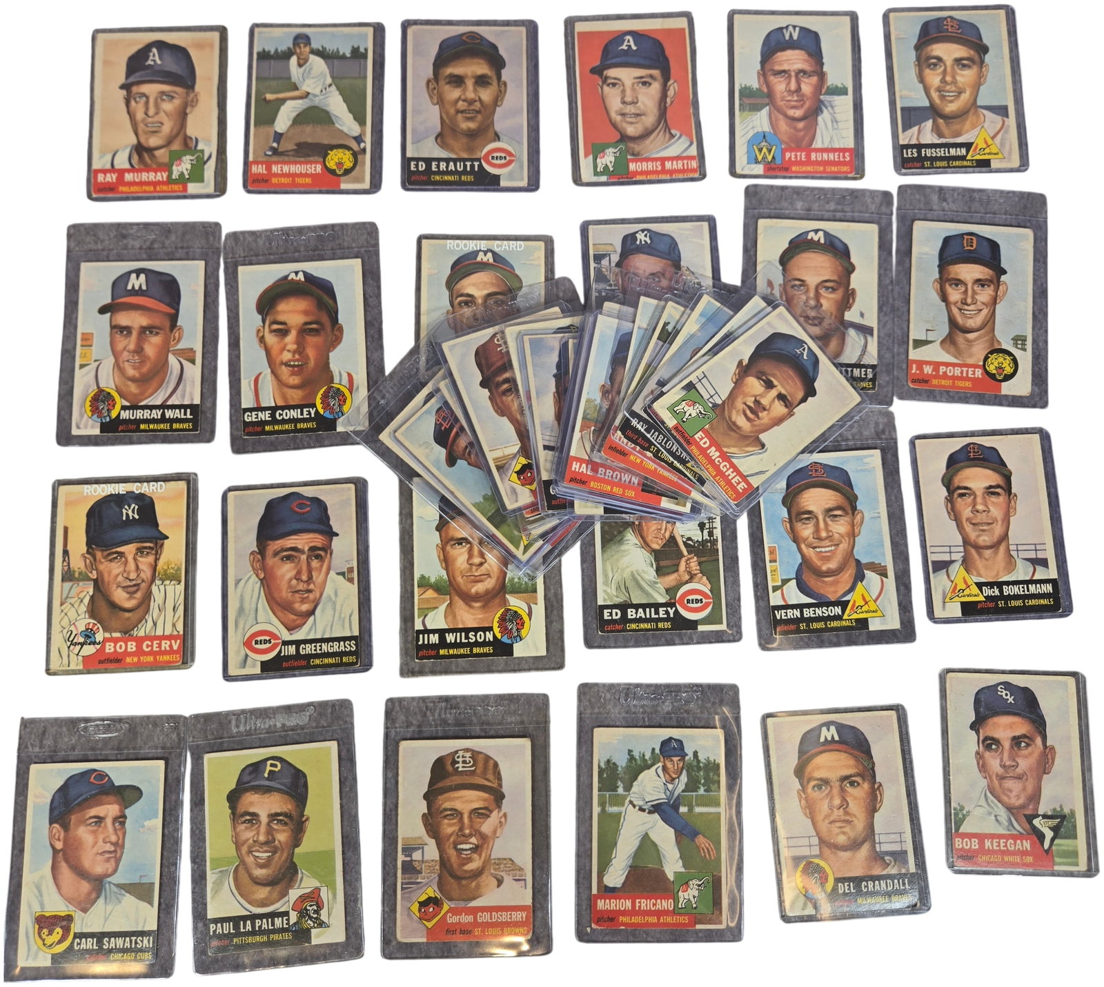 Collection of Approximately 50 1953 Topps Baseball Cards Including Hall of Famers and Rookies: This collection consists of vintage baseball cards from the 1953 Topps series. This set is notable for its horizontal layout and hand-painted player portraits. The lot features several cards with the 