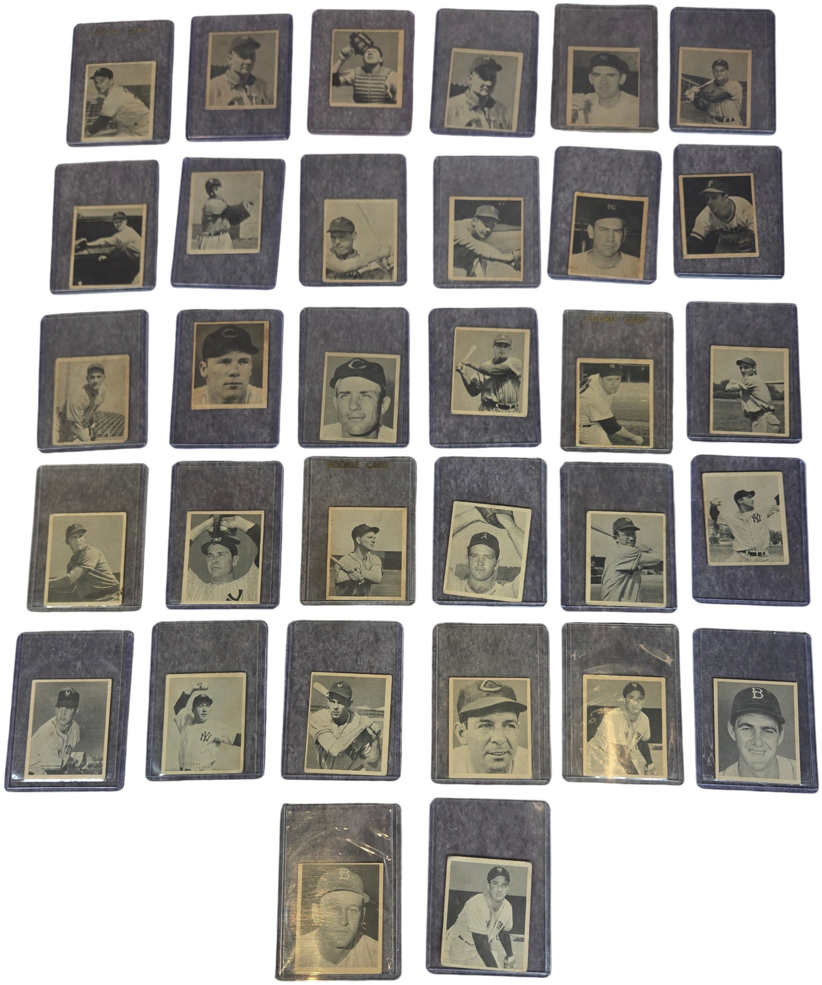 A Collection of 1948 Bowman Baseball Cards Including Major Hall of Fame Rookies: A collection of vintage baseball cards from the inaugural 1948 Bowman set, manufactured by Bowman Gum, Inc. These small-format cards feature black and white photographic portraits on cardstock. This l