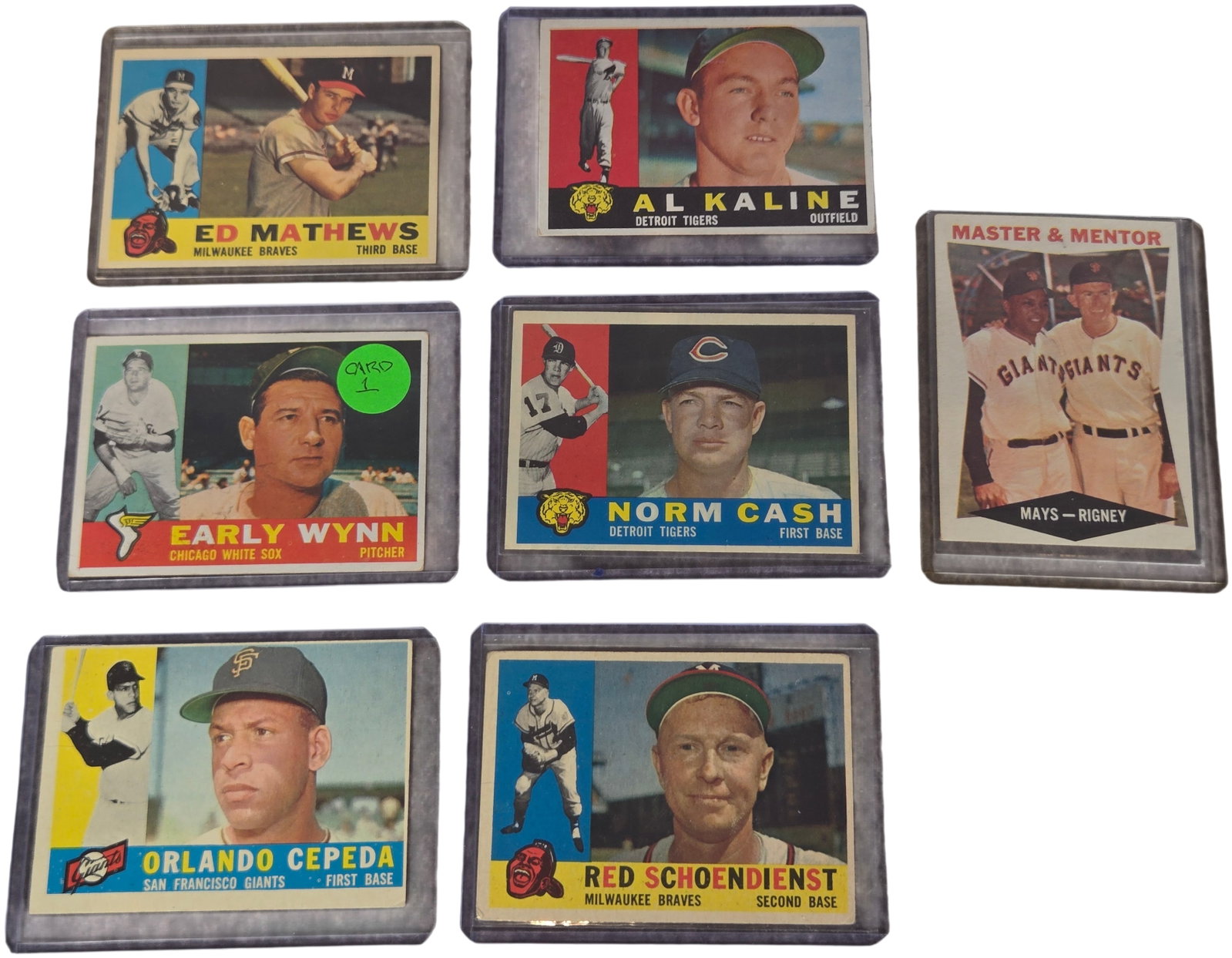 Lot of Seven 1960 Topps Baseball Cards Including A group of Hall of Famers: A collection of seven 1960 Topps baseball cards featuring a high concentration of Hall of Fame players. The cards are characterized by a horizontal orientation with distinct player photographs on the 