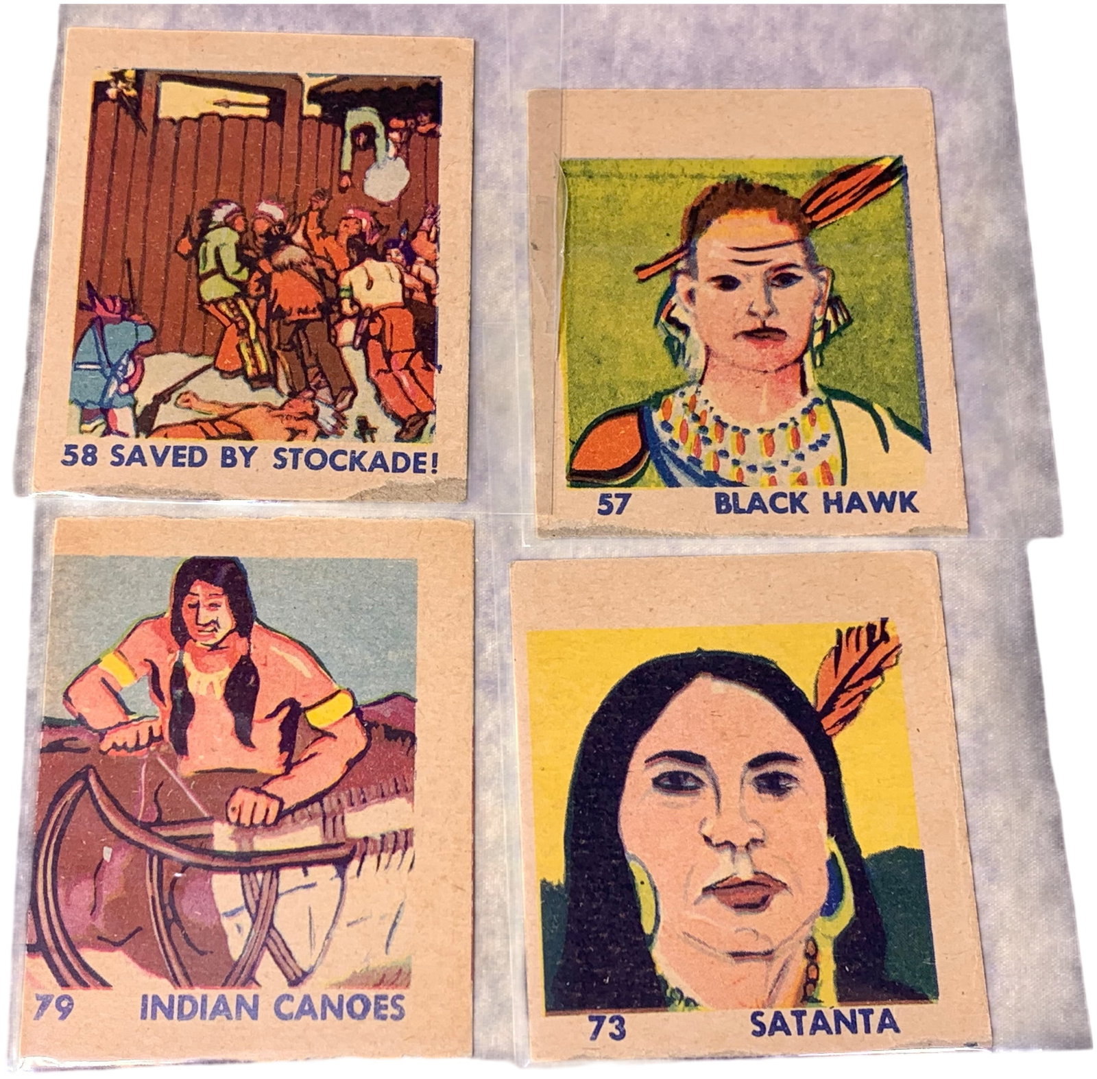 Collection of Four 1930s R131 Western Series Trading Cards: This group of vintage multicolored illustrated trading cards on tan cardstock features subjects including Black Hawk and Satanta, numbered 57, 58, 73, and 79, each bearing the mark © W.S. on the reve
