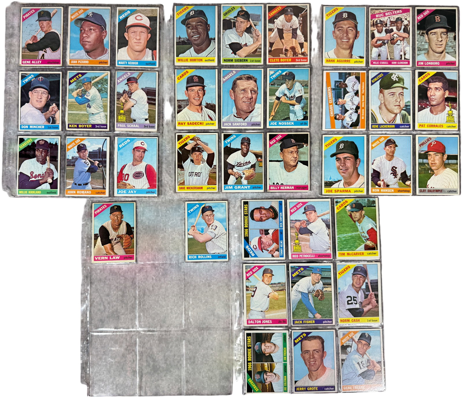 A Collection of 1966 Topps Baseball Cards: This collection consists of vintage baseball cards from the 1966 Topps set. The assortment includes a mix of individual player cards, multi-player cards, and rookie stars. A notable highlight of the g