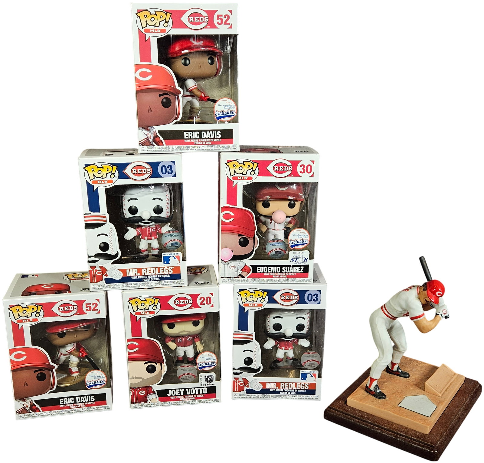 A Collection of Cincinnati Reds Memorabilia Including a Limited Edition Pete Rose Figurine and A: This lot contains a set of Cincinnati Reds sports memorabilia, featuring a commemorative figurine and several vinyl collectible figures. The primary item is a porcelain figurine titled Pete Rose 14 Fo