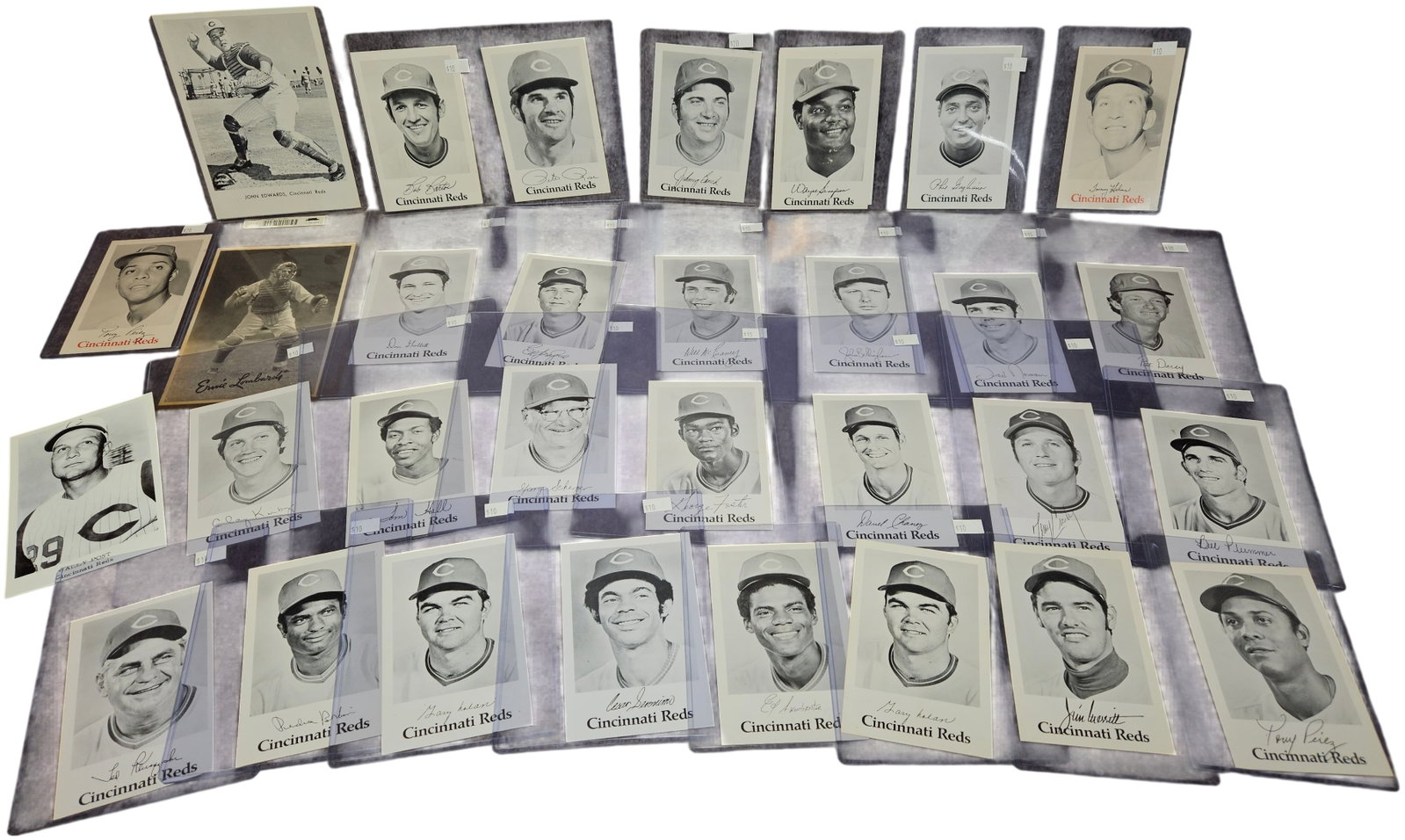 A Collection of Vintage Cincinnati Reds Promotional Baseball Photo Cards and Postcards: This is a collection of vintage Cincinnati Reds baseball items, primarily featuring promotional black and white photo cards and postcards from the 1970s Big Red Machine era, with some representation f