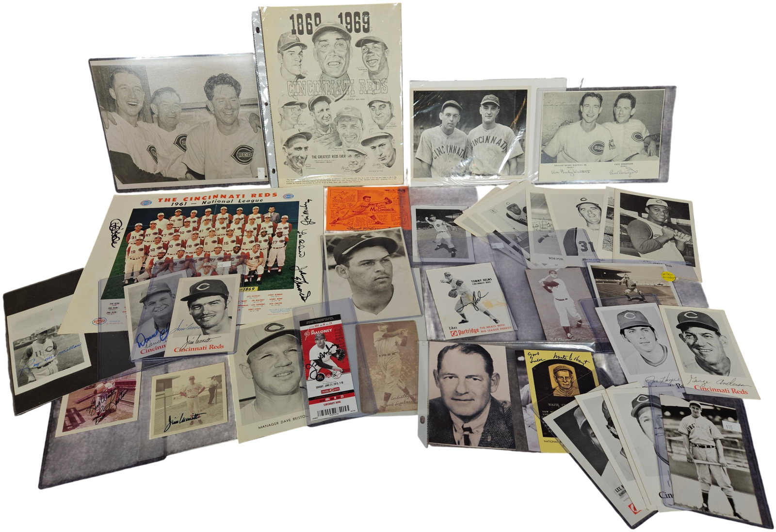 A Collection of Cincinnati Reds Baseball Memorabilia and Ephemera Including Posters and Autographed: A varied collection of Cincinnati Reds baseball memorabilia and ephemera spanning several decades. The lot features a 1961 National League Champions team photo poster presented by The Standard Oil Co.