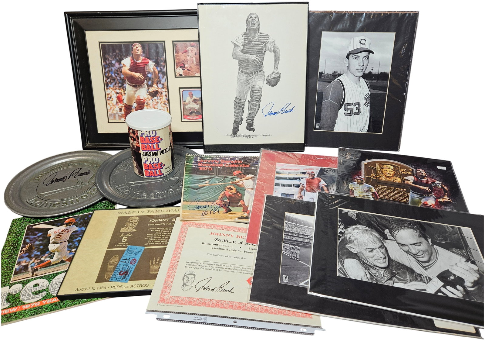 A Collection of Johnny Bench Cincinnati Reds Memorabilia and Signed Collectibles: A collection of memorabilia celebrating the career of Cincinnati Reds catcher and Hall of Famer Johnny Bench, covering his playing years from 1967 to 1983. Framed items include a color photograph coll