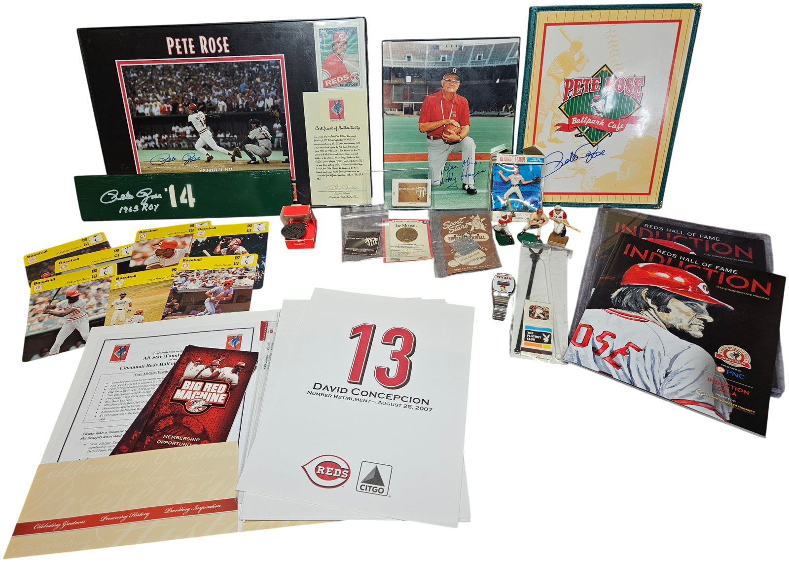 An Assortment of Cincinnati Reds and Pete Rose Memorabilia Including Autographed Items and Ephemera: This collection of Cincinnati Reds and Pete Rose memorabilia features several autographed pieces and vintage collectibles. The primary item is a framed commemorative display for the 25th anniversary o