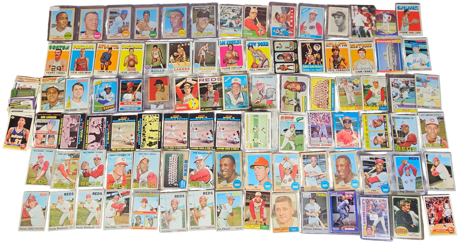 A Collection of Vintage and Modern MLB NBA and ABA Trading Cards Featuring Hall of Famers and Stars: This assortment consists of sports trading cards primarily from the 1960s and 1970s, with a small selection of modern 1990s issues. The collection features a heavy concentration of Cincinnati Reds pla