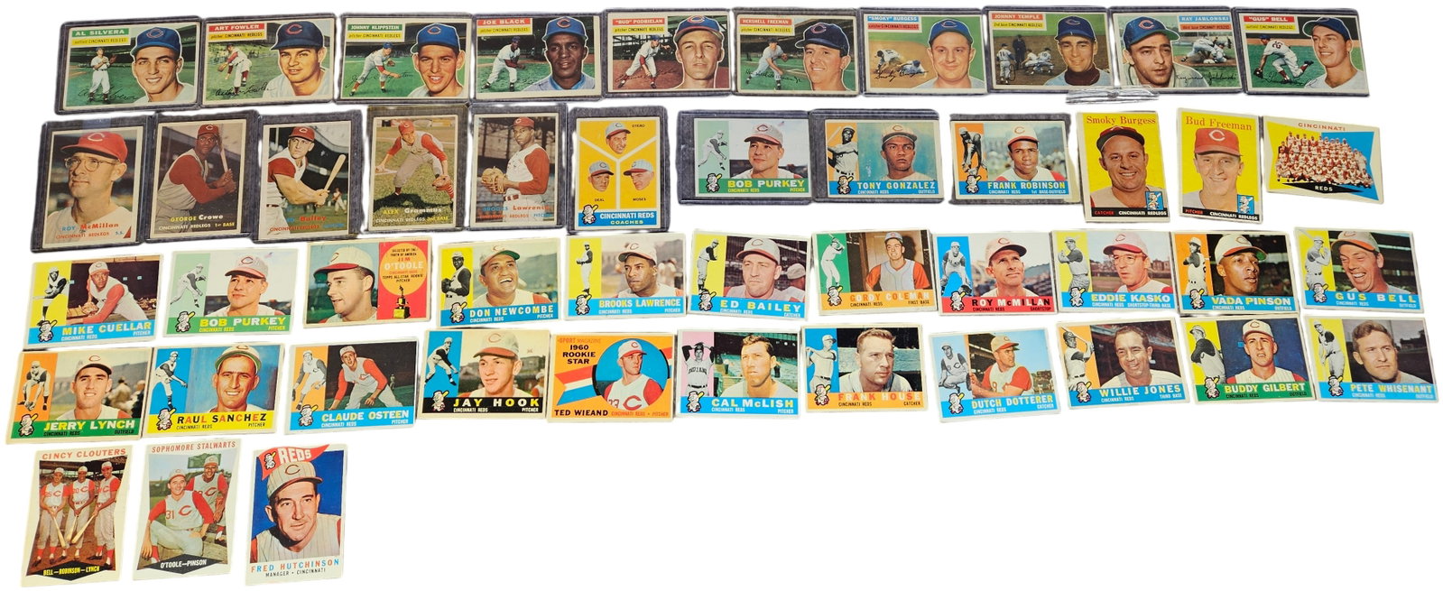 A Collection of Topps Cincinnati Reds Baseball Cards, 1958-1961: A collection of vintage baseball cards produced by Topps, featuring players from the Cincinnati Reds (also known as the Cincinnati Redlegs) spanning the years 1958 through 1961. The group includes var