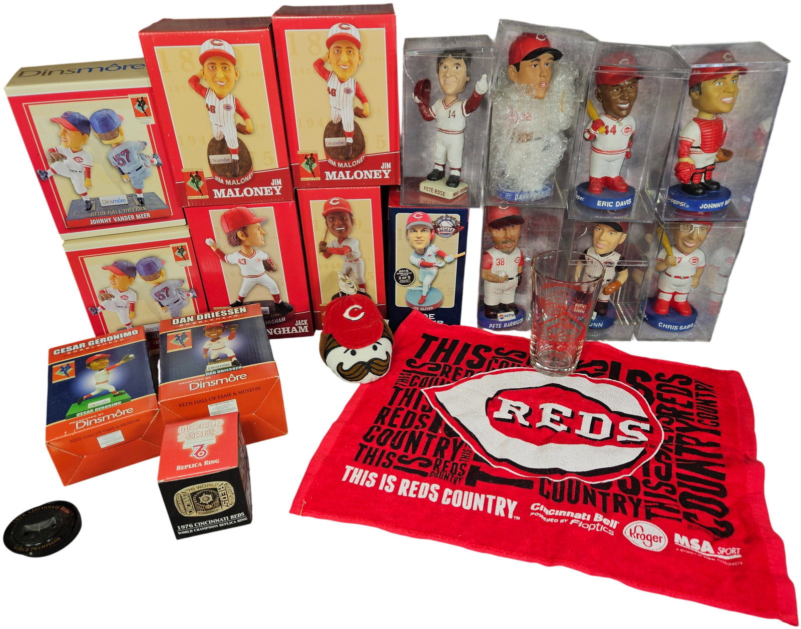A Collection of Cincinnati Reds Bobbleheads and Commemorative Sports Memorabilia: A large collection of Cincinnati Reds baseball memorabilia, primarily featuring an assortment of bobbleheads from the Dinsmore Reds Hall of Fame and Museum series and various promotional releases. The