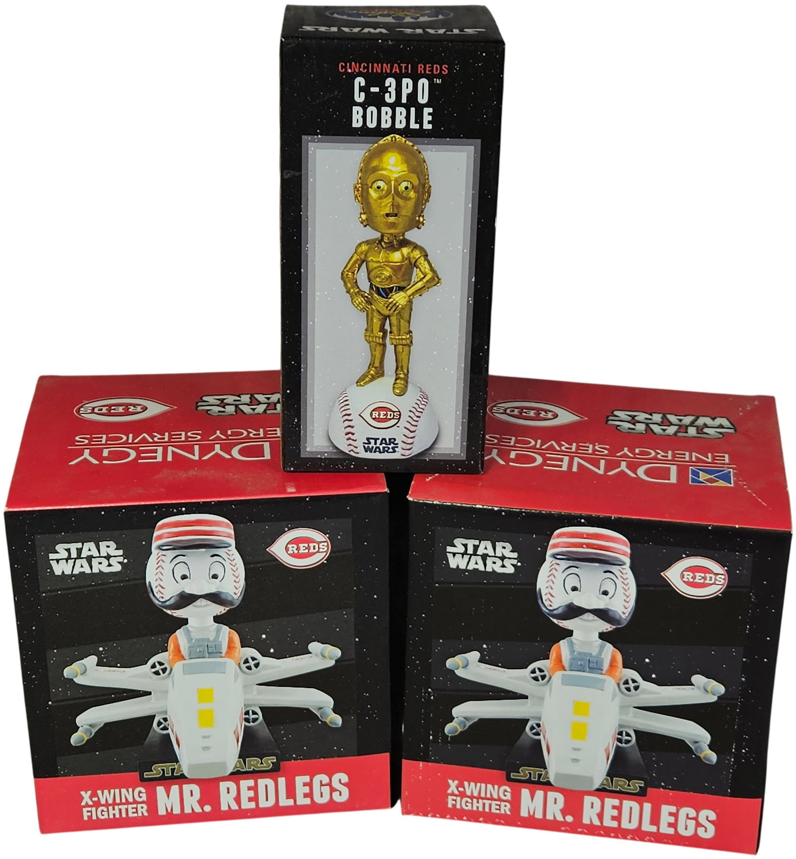 A Trio of Cincinnati Reds Star Wars Promotional Bobbleheads: This lot contains Cincinnati Reds promotional bobbleheads with Star Wars themes, all in their original packaging. The collection consists of Mr. Redlegs X-Wing Fighter bobbleheads and a C-3PO bobblehe