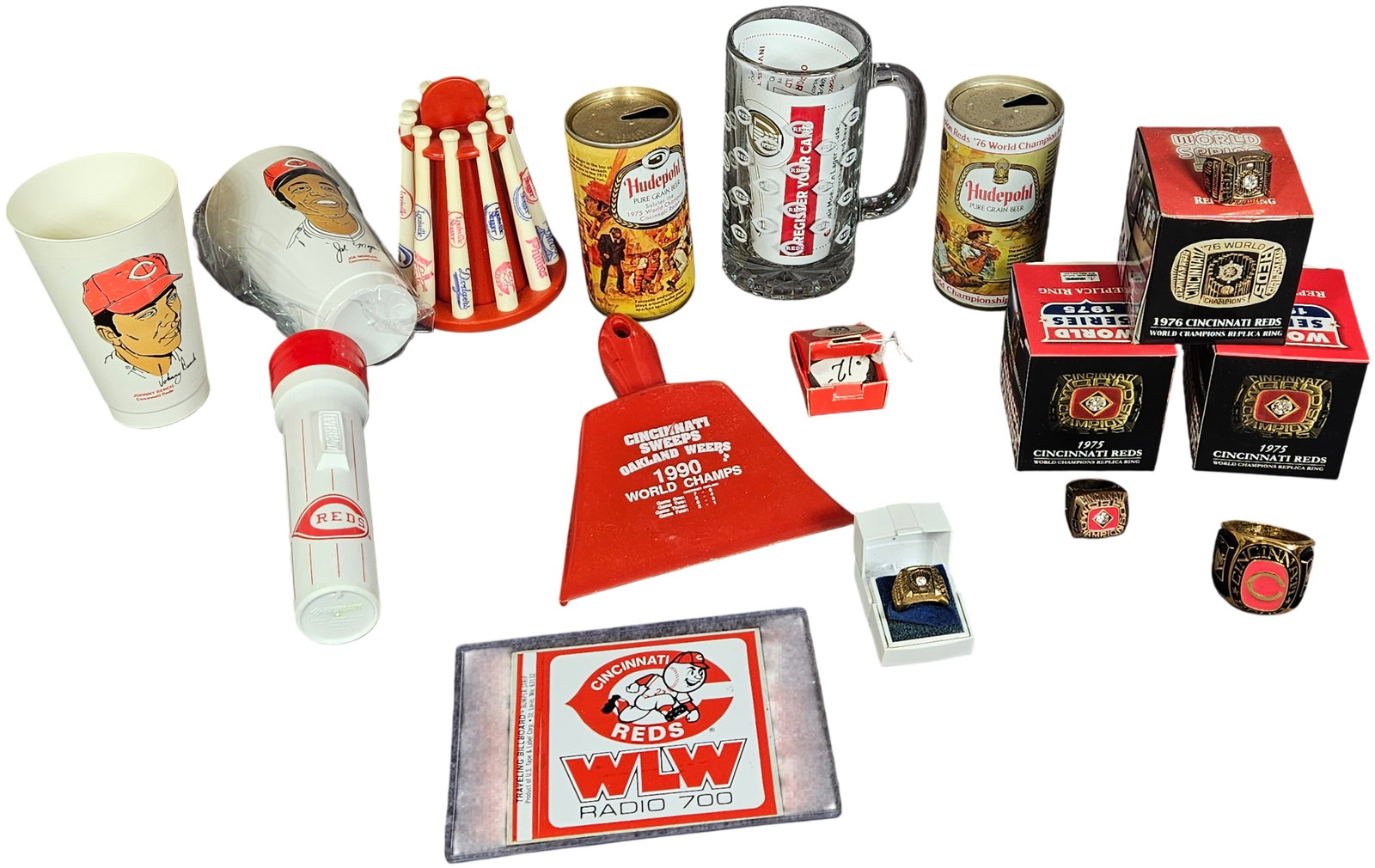 A Collection of Cincinnati Reds World Series Commemorative Memorabilia and Replica Rings: This collection of Cincinnati Reds baseball memorabilia focuses on the team championship history, specifically the 1975, 1976, and 1990 World Series. Included are replica World Series rings, with some