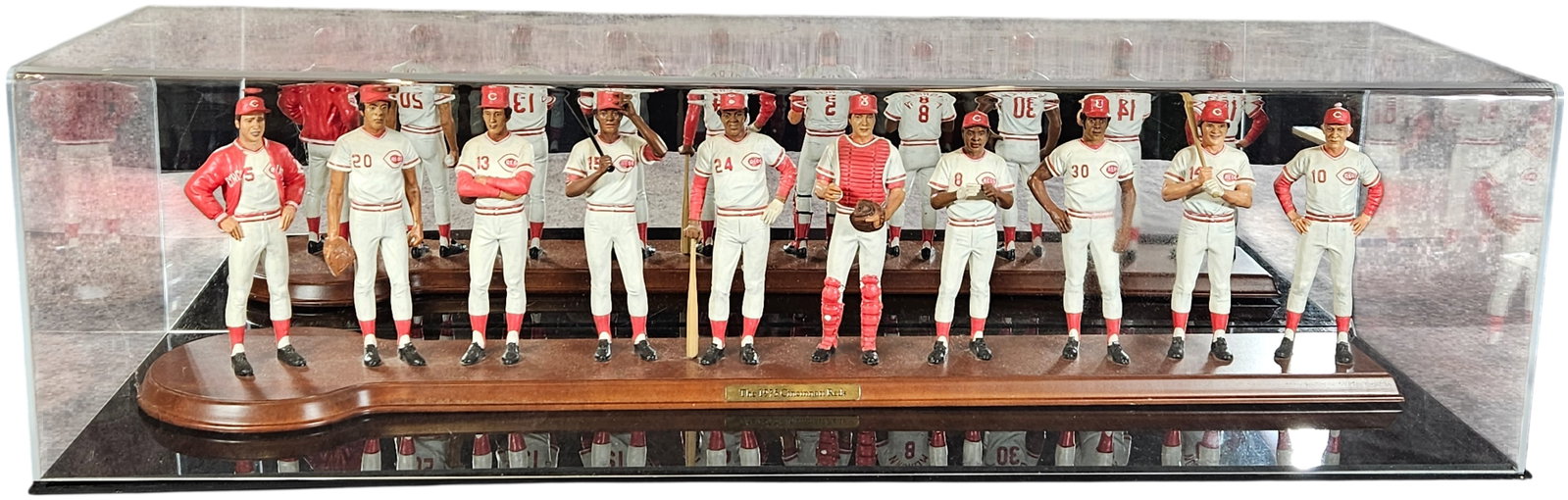Danbury Mint 1975 Cincinnati Reds Big Red Machine Commemorative Figurine Set: A commemorative group of hand-painted figurines honoring the 1975 Cincinnati Reds World Series championship team, known as the Big Red Machine. This set, attributed to the Danbury Mint based on market