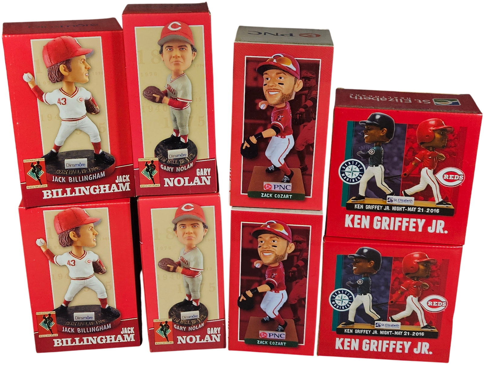 A Collection of Cincinnati Reds Stadium Giveaway Bobbleheads Including Ken Griffey Jr.: A collection of Cincinnati Reds stadium giveaway (SGA) bobblehead figurines in original retail packaging. The group features various players including Jack Billingham and Gary Nolan, both part of the 