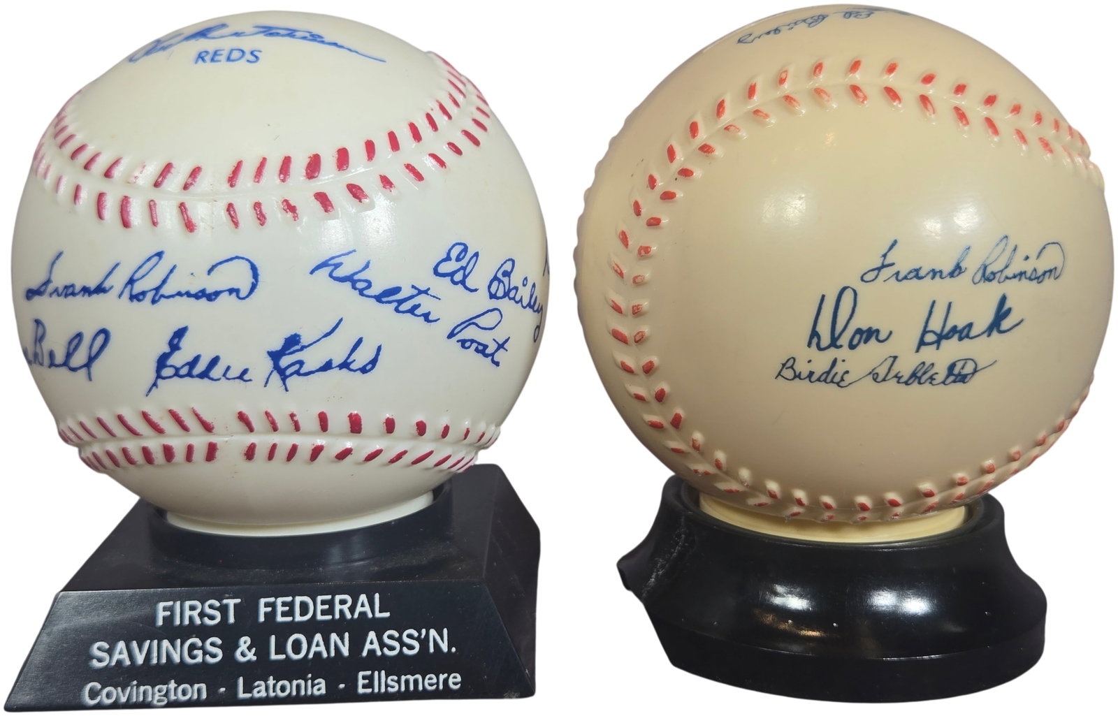 A Pair of Vintage Cincinnati Redlegs Promotional Baseball Banks by Koster Dana-Barrell Inc.: This lot consists of mid-century promotional baseball coin banks produced for the Cincinnati Redlegs, featuring factory-printed facsimile signatures from the 1956-1957 team roster. The first bank feat