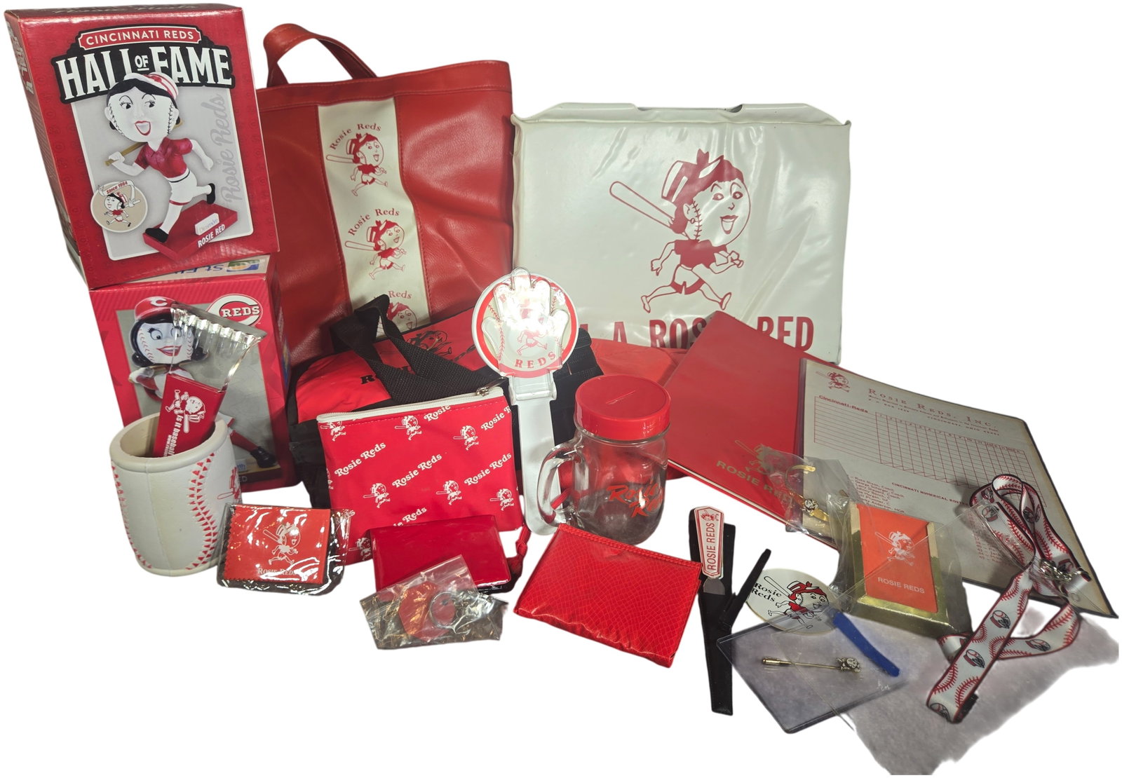 A Collection of Cincinnati Reds Rosie Reds Fan Club Memorabilia and Souvenirs: This group of Cincinnati Reds memorabilia centers on the Rosie Reds fan organization. The collection includes boxed bobbleheads, with versions representing the Cincinnati Reds Hall of Fame sponsored b