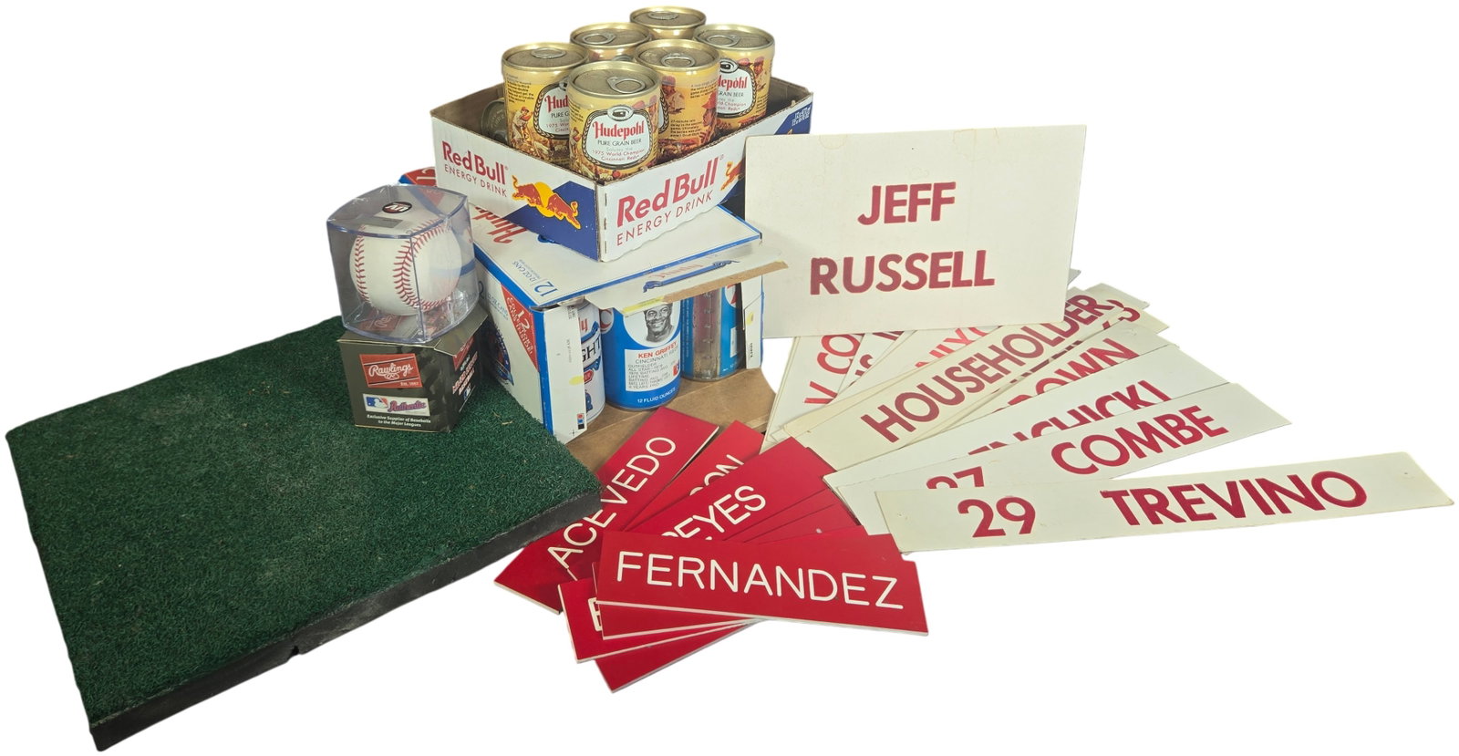 A Collection of Cincinnati Reds Baseball Memorabilia Featuring Hudepohl Commemorative Cans and: An assortment of Cincinnati Reds and professional baseball memorabilia. The collection includes several Hudepohl Pure Grain Beer cans featuring 1975 World Series commemorative graphics, including a ca